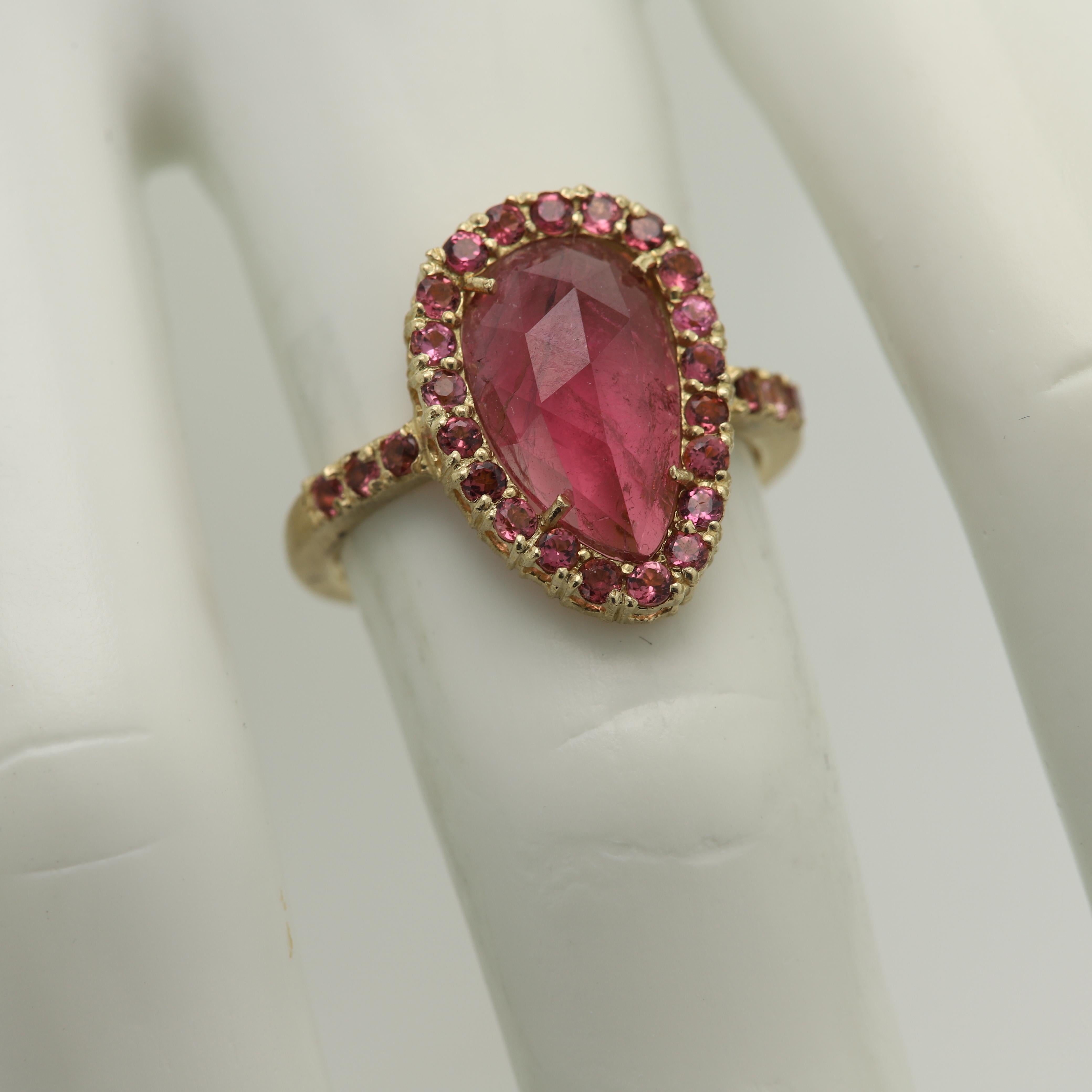 Vintage Pink Tourmaline Ring - Hand Made in Italy
14k Yellow Gold 4.8 grams - mat finish (not shiny)
Small Round Pink Tourmaline around on the sides 0.58 ct
Center is a 