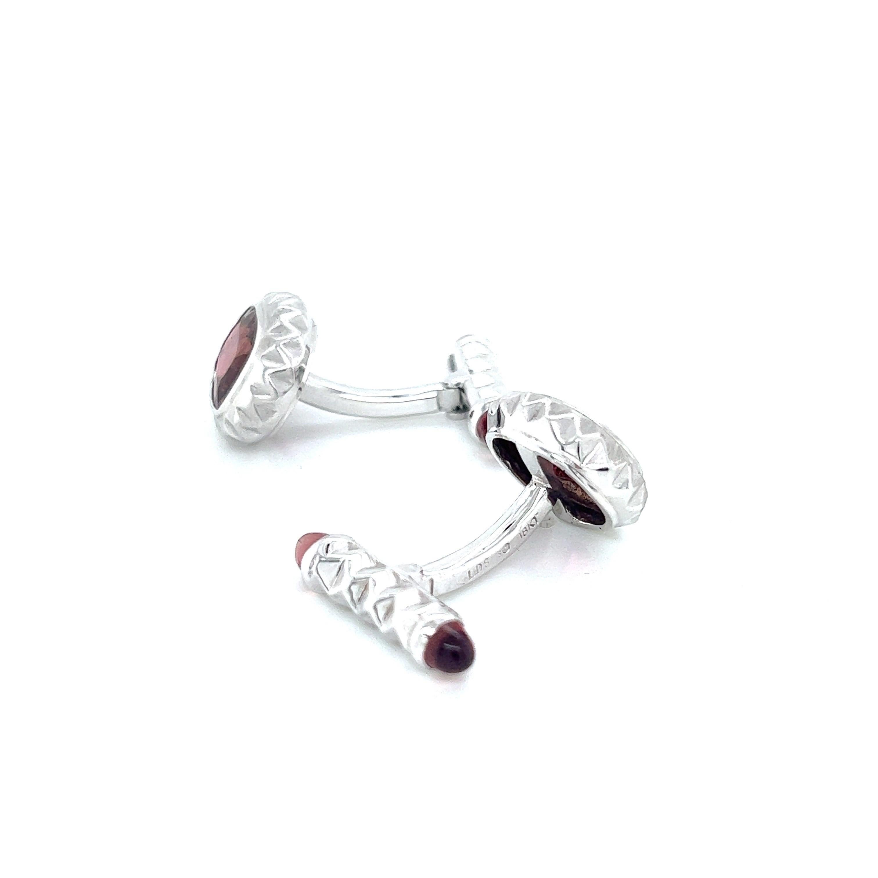 18k white gold cufflinks with cushion cut pink tourmaline center and pink tourmaline bullets in the back are a beautiful and luxurious accessory that adds a pop of color and elegance to any formal or semi-formal outfit. The cufflinks feature a