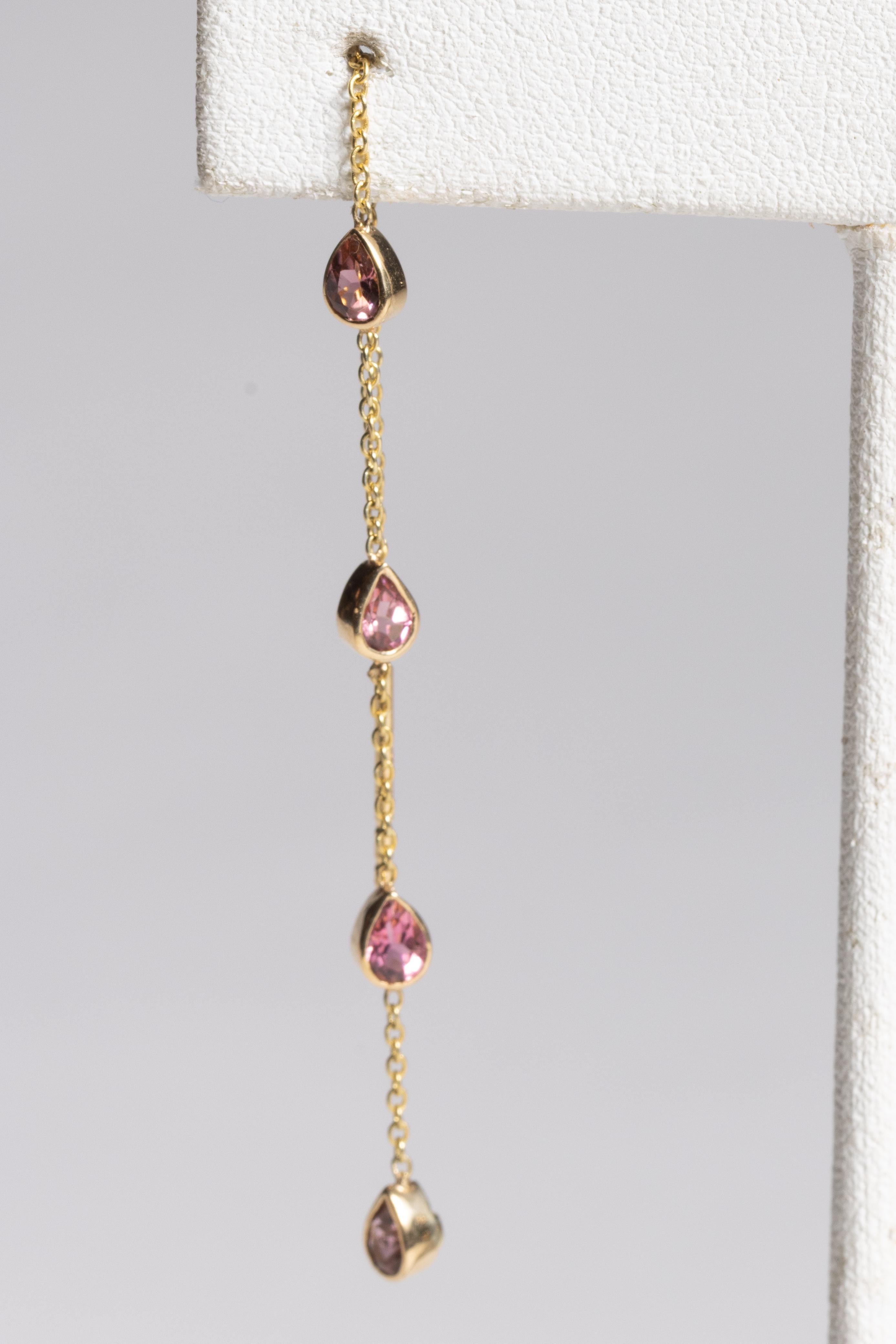 A pair of threader or pass-through chain earrings with 4 faceted, pear-shaped pink tourmaline gemstones.  Also includes butterly push back.  For pierced ears.  

The fine jewelry collection is sourced, designed or created by Deborah Lockhart