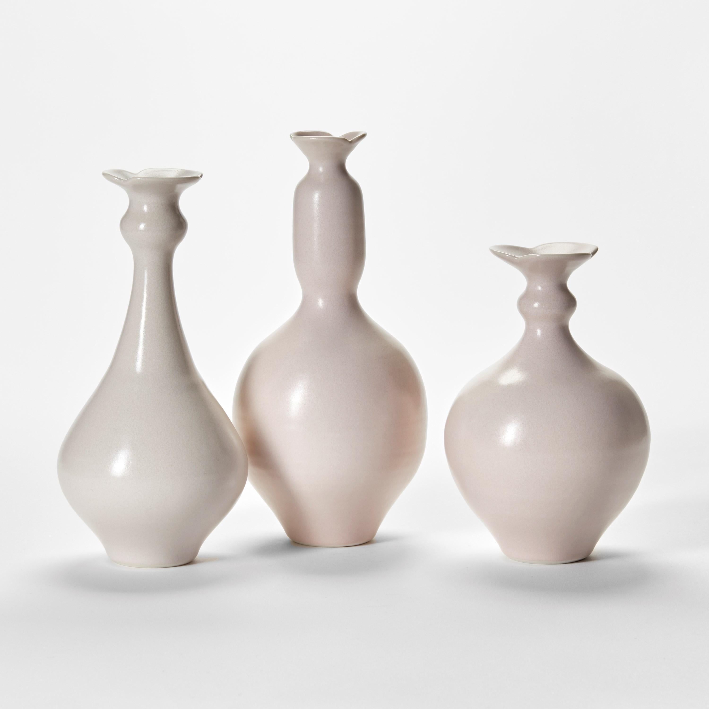 'Pink Trio’ is a unique collection of porcelain sculptural vessels by the British artist, Vivienne Foley.

Left to right in the first image;

Pink Thistle Bottle  H 23cm W 11.5 cm D 11.5 cm
Pink Thistle Bottle II  H 25 cm W 11.5 cm D 11.5 cm
Pink