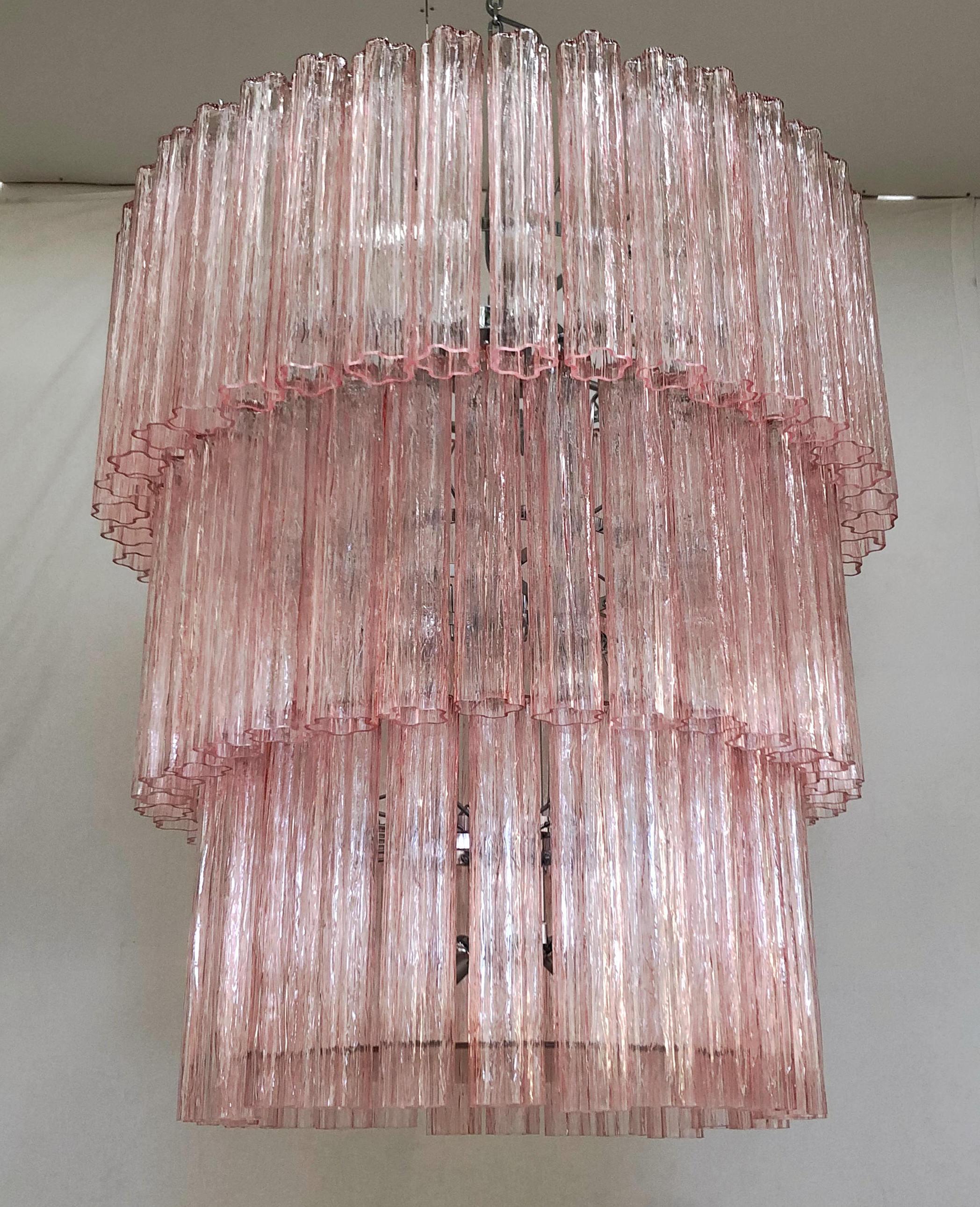 Italian chandelier shown in pink hand blown Murano Tronchi glasses arranged in 3 tiers, mounted on polished chrome finish metal frame with a frosted pink glass diffuser at the bottom / Designed by Fabio Bergomi for Fabio Ltd / Made in Italy
15