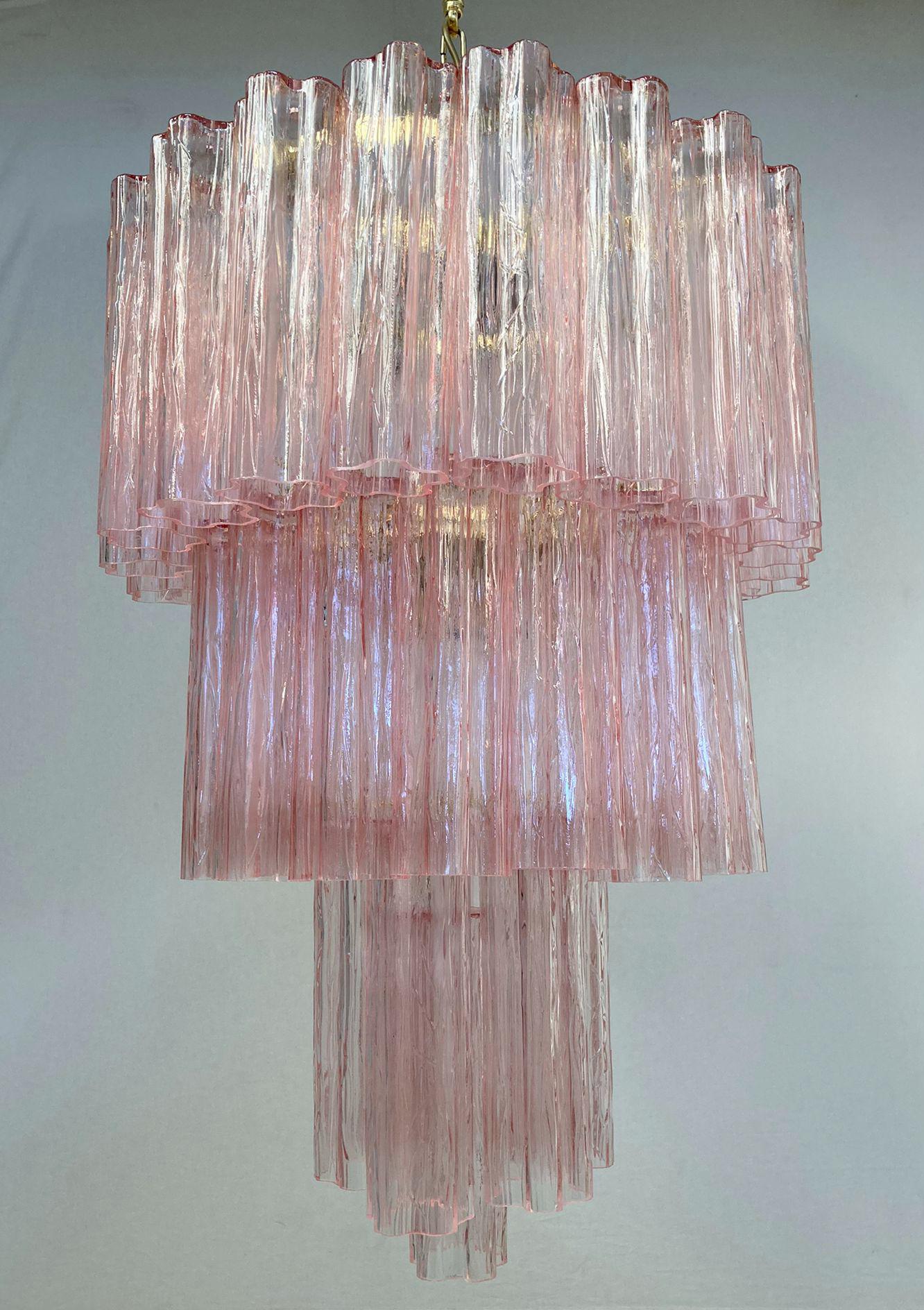 Vintage Italian chandelier with pink hand blown Murano Tronchi glasses arranged in 3 tiers, mounted on brass frame / Made in Italy circa 1960s
4 lights / E26 or E27 type / max 60W each 
Measures: diameter 21.5 inches, height 31.5, total height 43.5