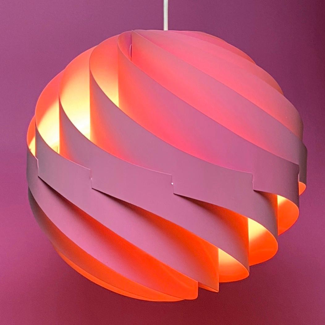 The original Turbo ceiling light was made in white, orange and this pink lacquered version in 1967 by Louis Weisdorf for Lyfa, Denmark.

Weisdorf is known for some of the most beautiful Danish lighting designs and the Turbo is no exception. From all