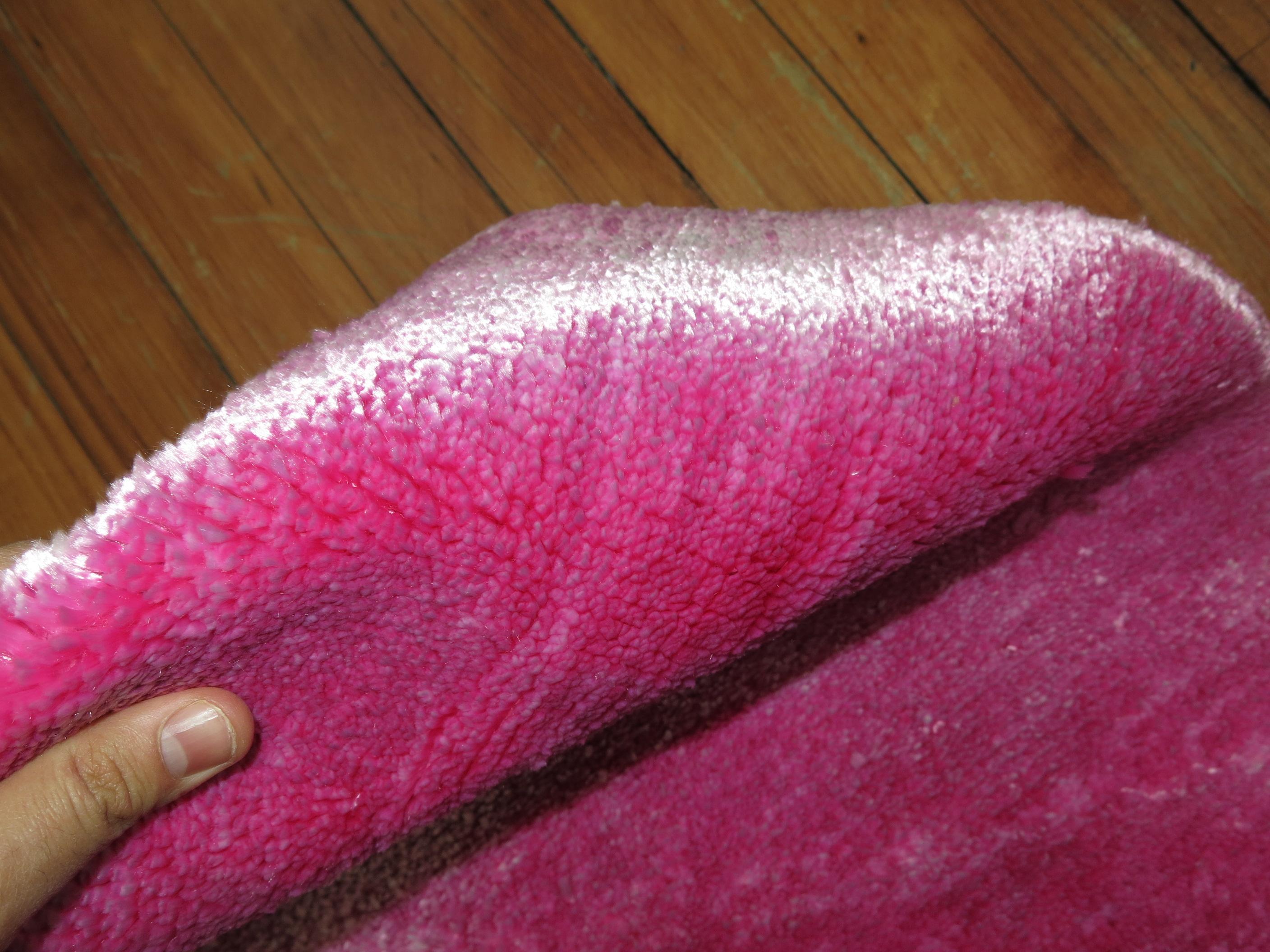 Contemporary handwoven 100 % silk Turkish rug in bright pink.

2'8'' x 4'8''