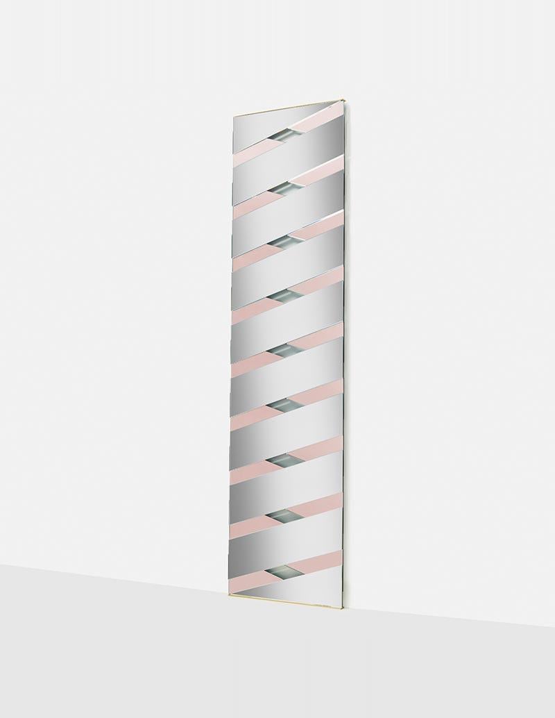 Pink twill mirror by Mason Editions
Dimensions: 45 × 3 × 171 cm
Materials: glass
Colours: pink, sage green, smoke grey

A clear reference to the weaving motif: the rectangular Twill mirror is a tribute to the exclusive world of men’s tailoring.