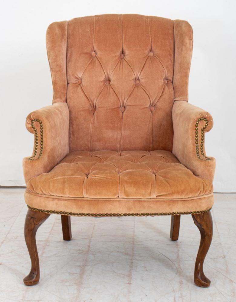 Pink Velvet Upholstered Wing Back Armchair, nail head details to arms, upon wood cabriole legs. 
