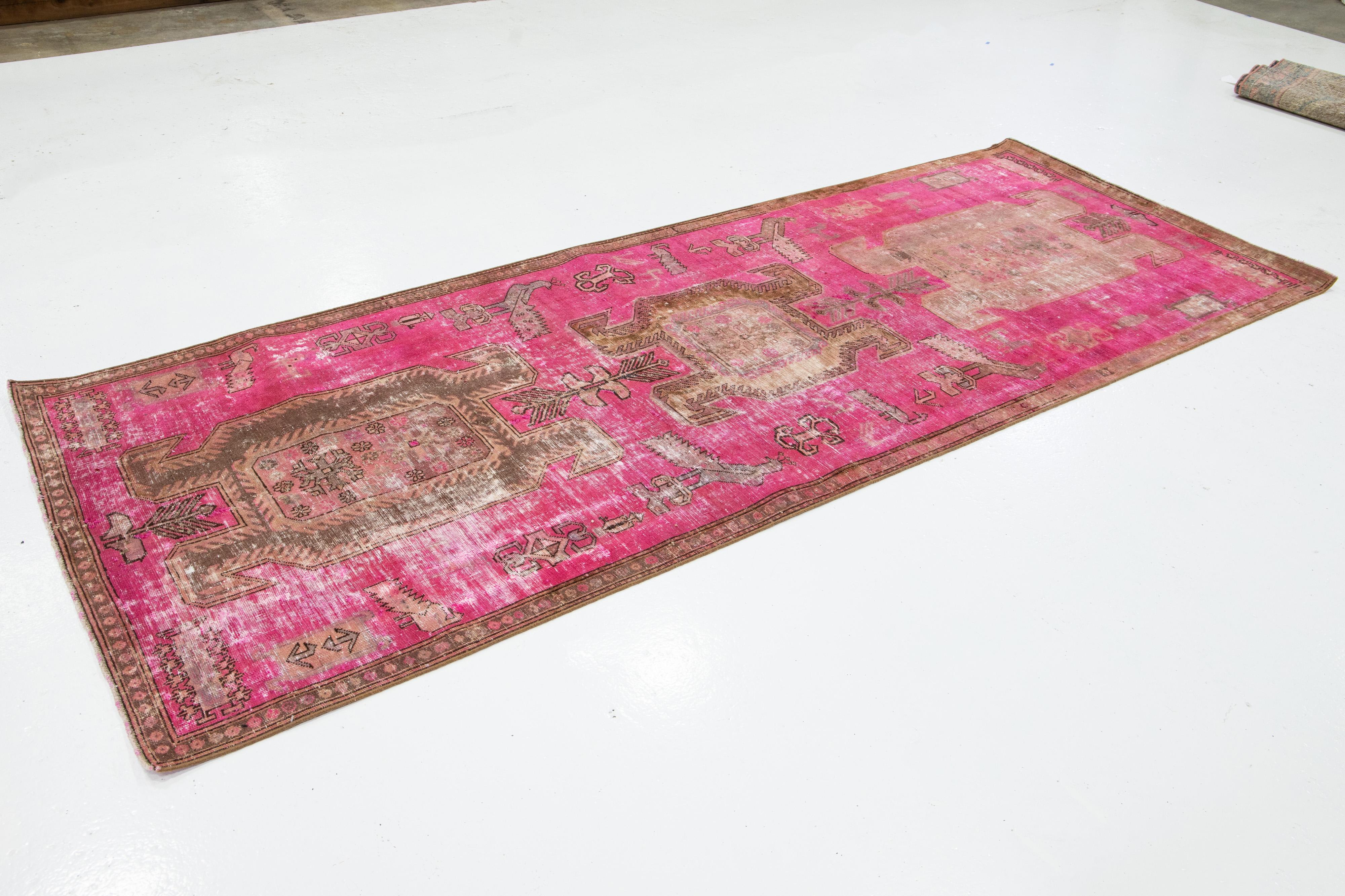 Islamic Pink Vintage Distressed Persian Wool Rug With Tribal Design For Sale