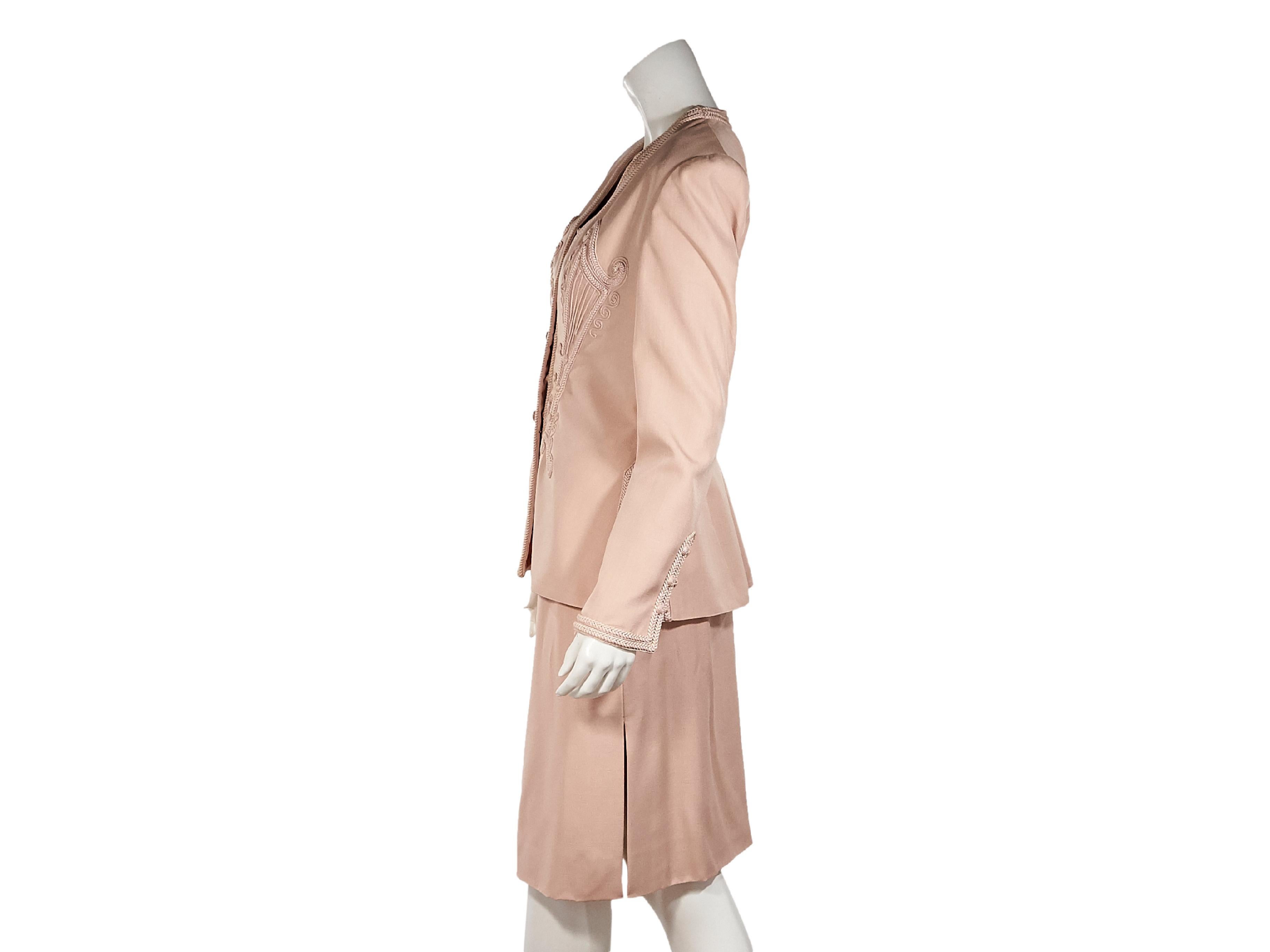 Product details:  Vintage pink skirt suit set by Valentino.  Trimmed with braided silk applique.  Circa the 1980s.  V-neck.  Long sleeves.  Button-front closure.  Side hem slits.  Matching bustier top.  Sleeveless.  Squareneck.  Button-front