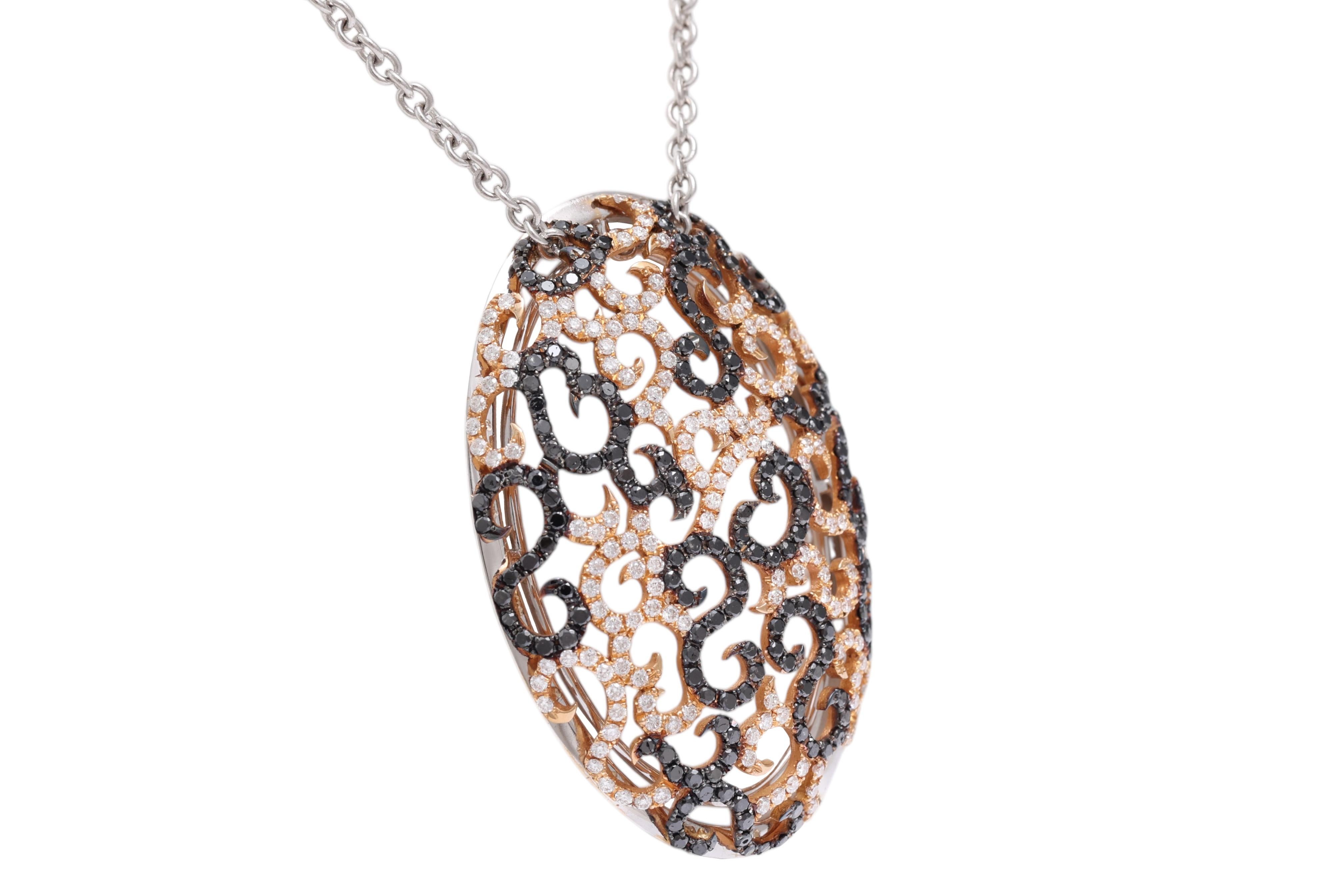 PINK & WHITE GOLD NECKLACE WITH BLACK & WHITE DIAMONDS

MATERIAL: 18 kt white and pink gold

SIZE: 34 mm x 48.50 mm

DIAMONDS: black diamonds (together ca. 2.12 Cts), white brilliant cut diamonds (together ca. 1.45 Cts)

Total Weight : 22.1 Gram