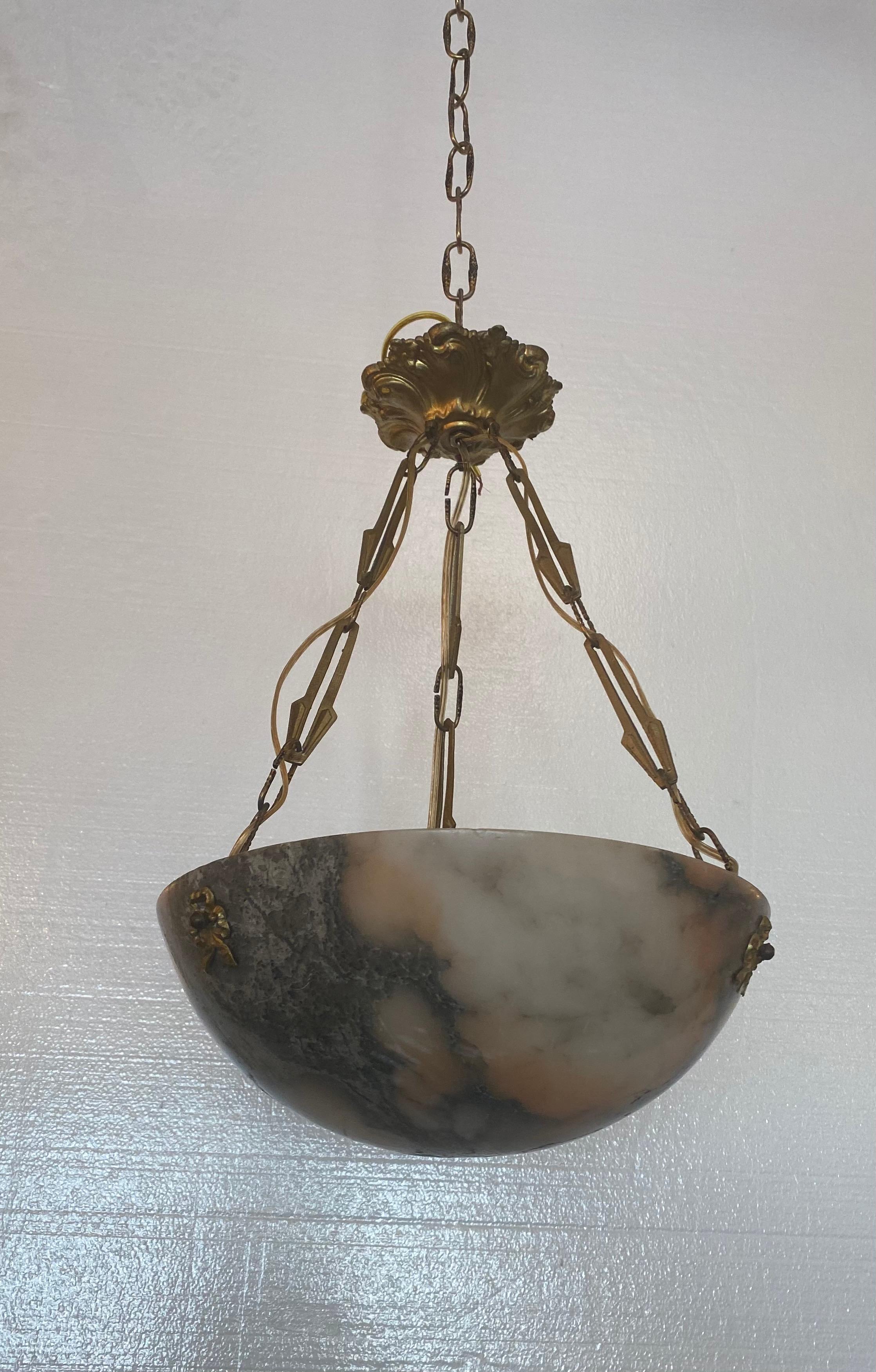 Quality white and pink marble and doré bronze chandelier. Good overall estate fresh condition with minor wear.