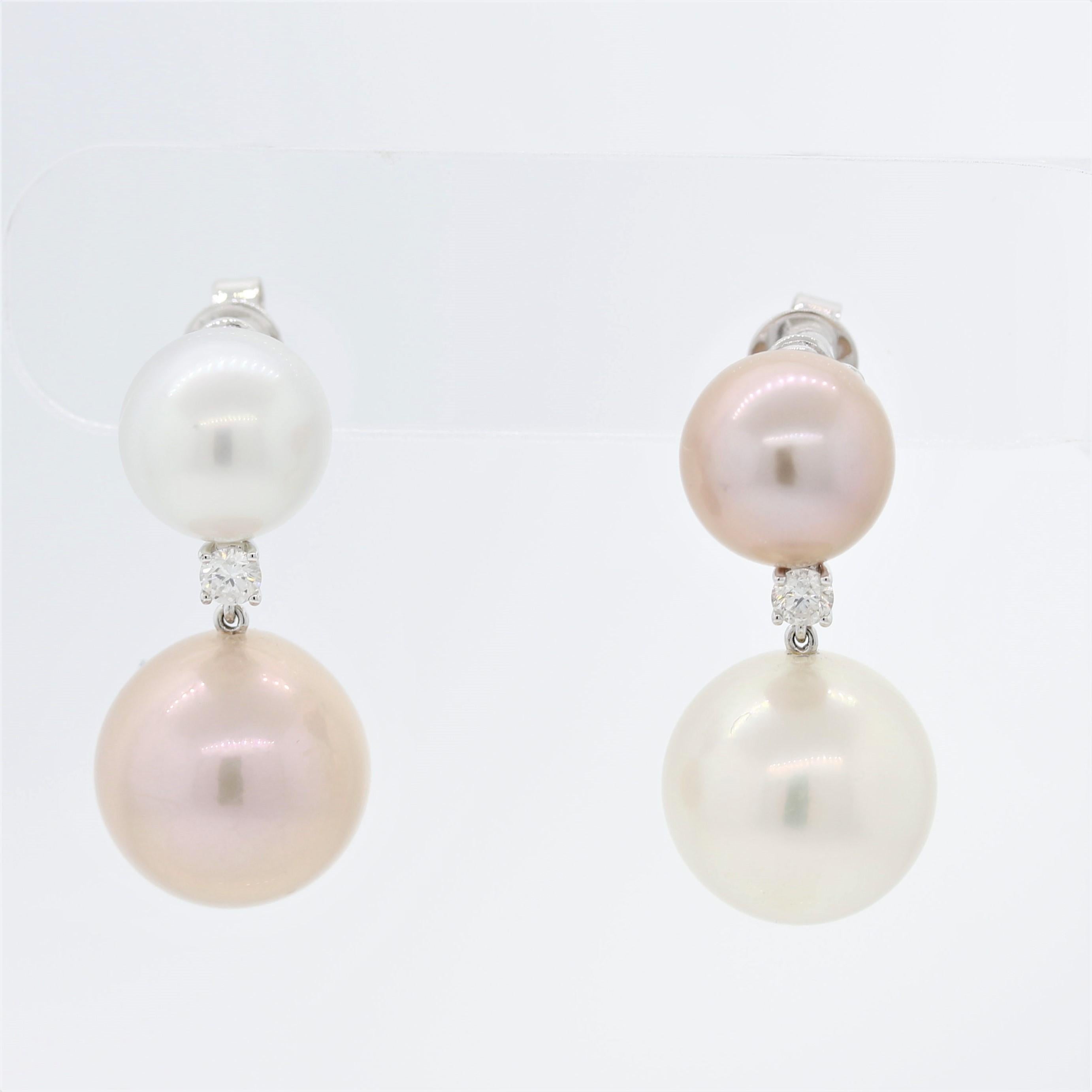 A pair of South Sea earrings featuring white & pink colors! The two larger drop pearls measure about 16mm each while the smaller pearls on the top are about 12mm each. Set inversely, pink and white, it gives the earrings a stylish designer look.