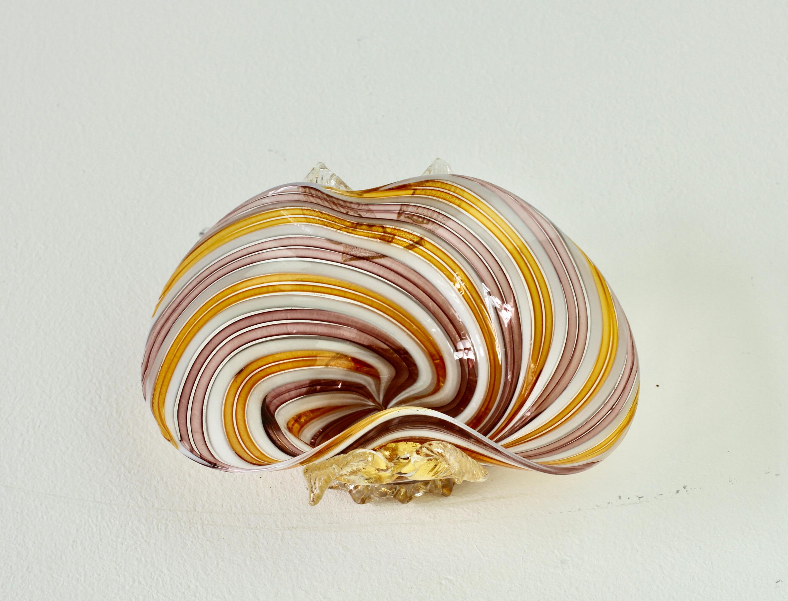 This is a magical piece of Murano glass - displaying some exquisite Italian glass techniques. Captured in stunning colours of pink/lilac, yellow, white and clear 'fliligrana' glass (glass canes placed together flat on a plate before being melted to