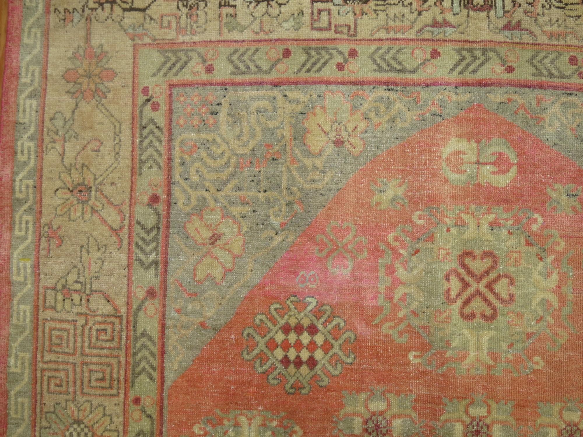 East Turkestani Pink Yin Yang Antique Khotan Rug For Sale