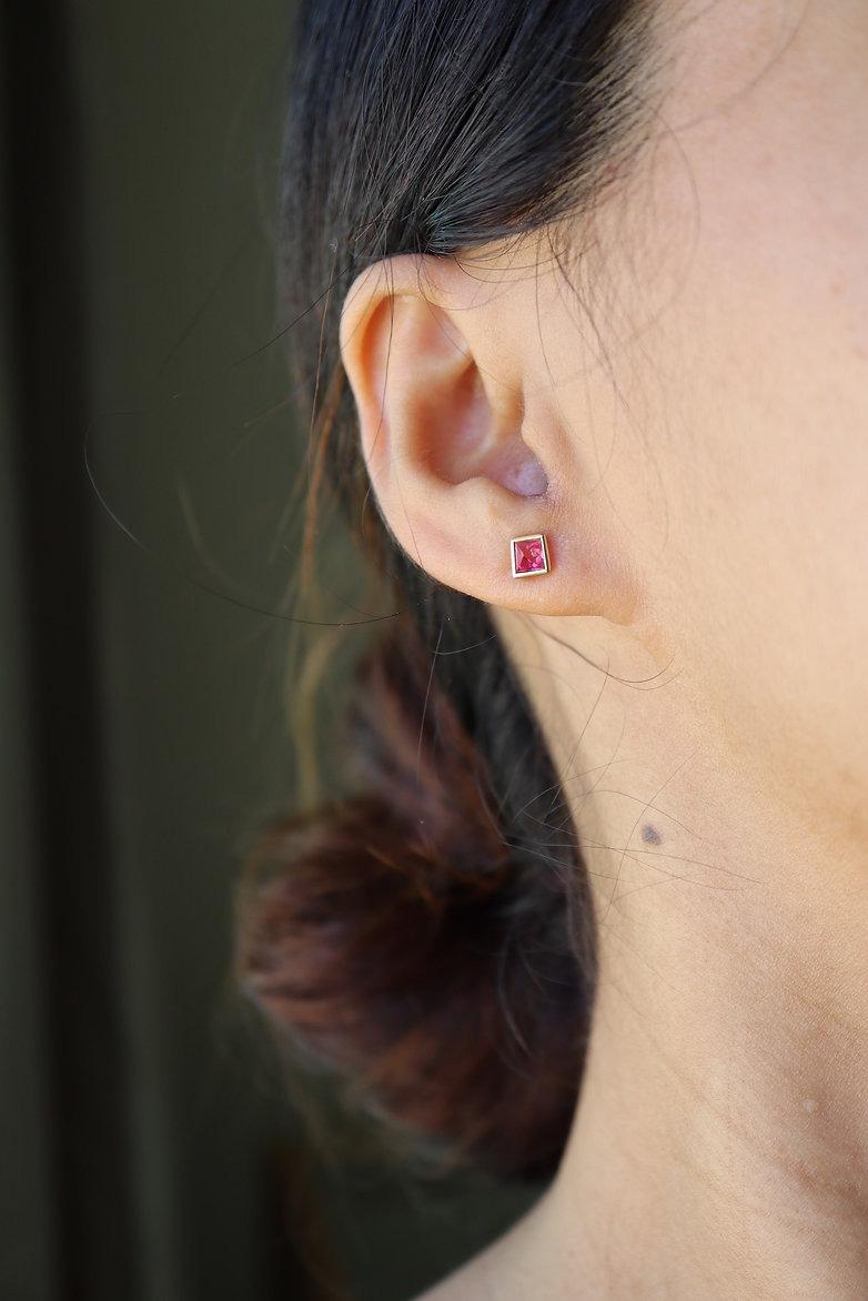 Pinkish Red Angel Cut Spinels Stud Earring

Here is something unique.
Classic angel cut spinel from Man Sin in the Mogok Valley, Burma/Myanmar. A strongly fluorescent pink-red and a neon-like radiance.
Burmese locals call it Nat Thwe (နတ်သွေး) -