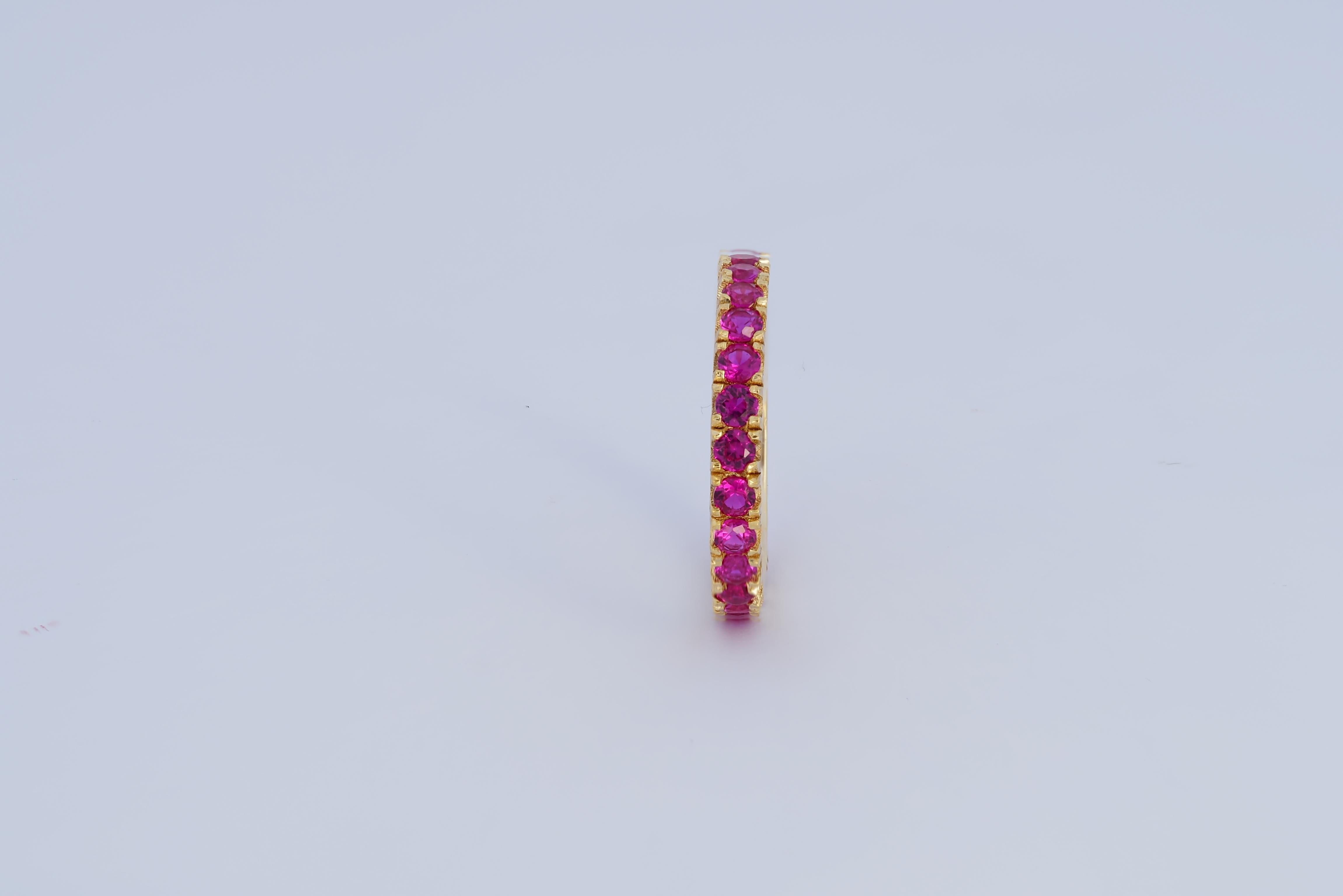 For Sale:  Pinkish red gemstone 14k gold eternity ring band. 11