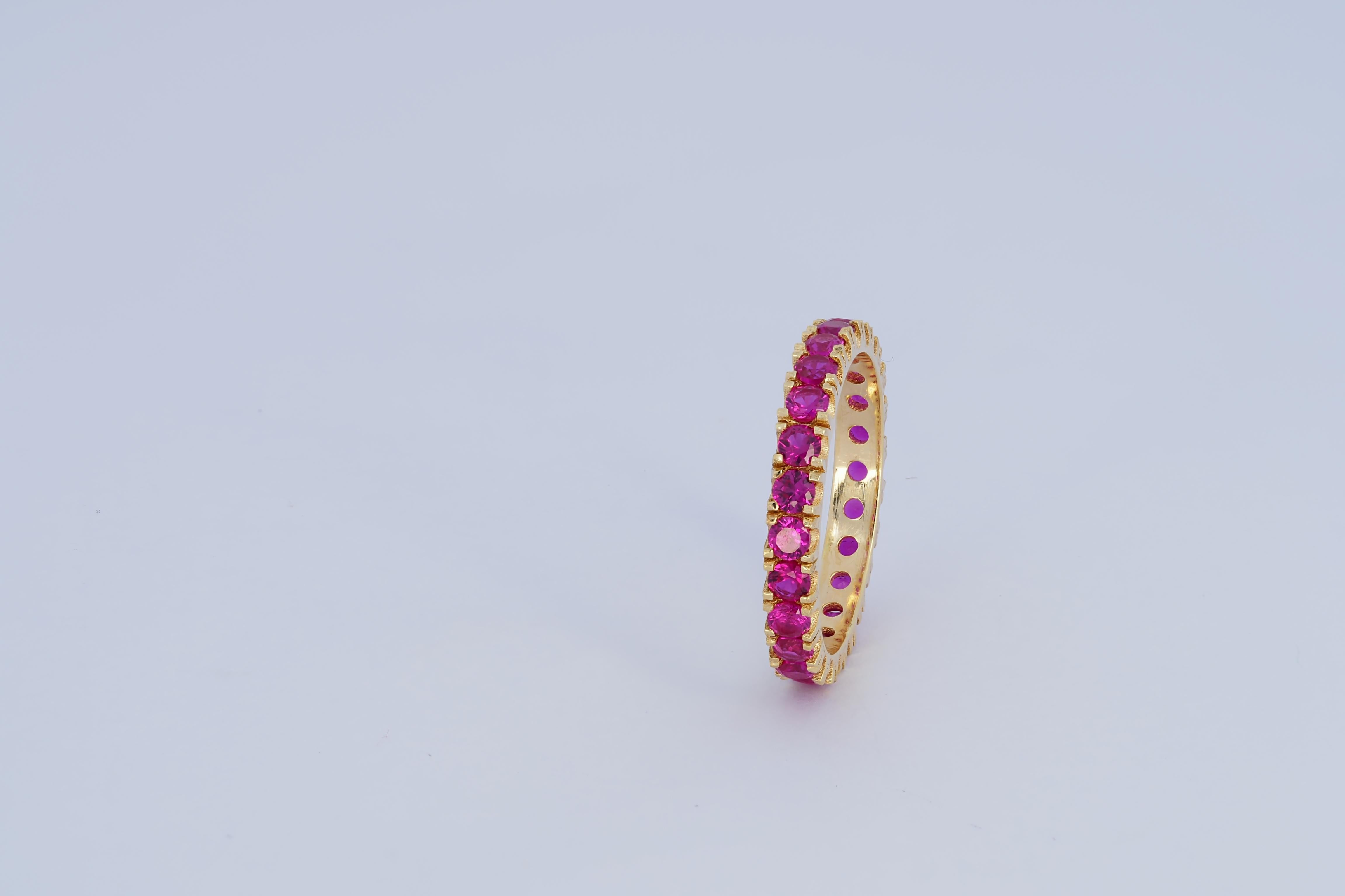 For Sale:  Pinkish red gemstone 14k gold eternity ring band. 8
