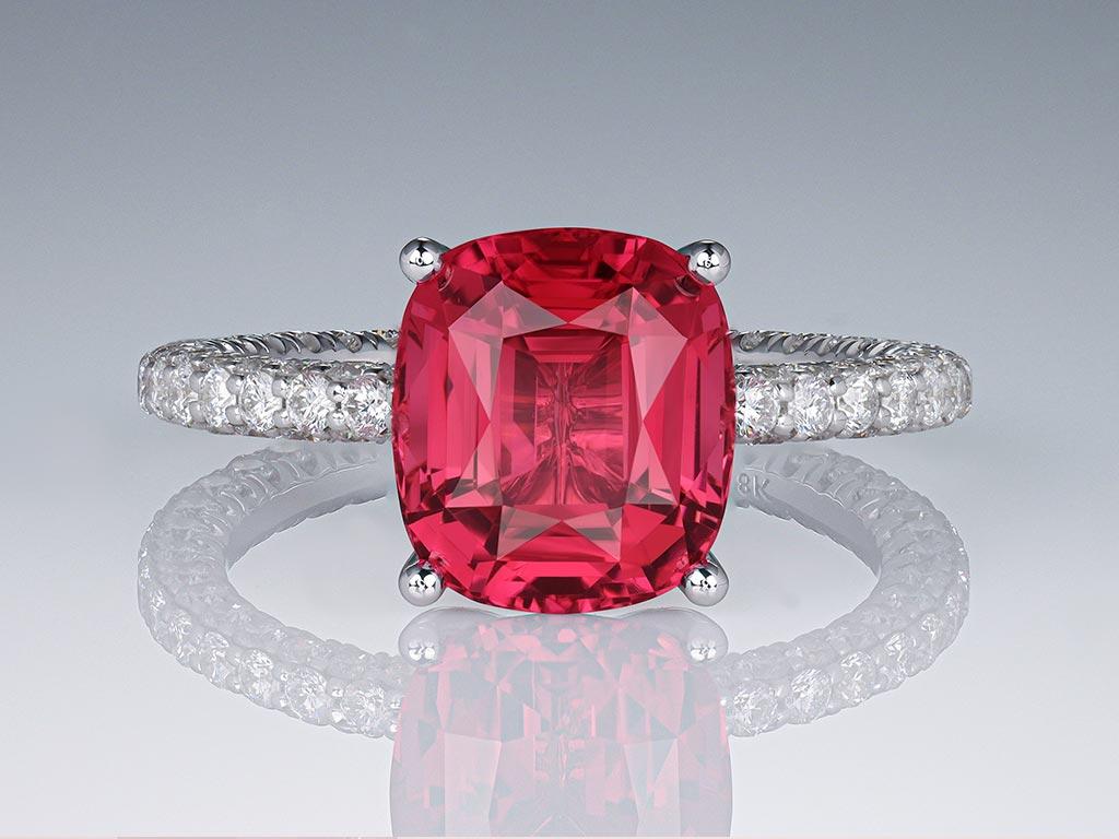 Introducing the epitome of elegance: our 3.63 carat Pinkish-Red Tourmaline Rubellite ring. Crafted to perfection, this stunning piece features a stylish cushion-cut shape, accentuating the rich hue and vibrant play of the exquisite