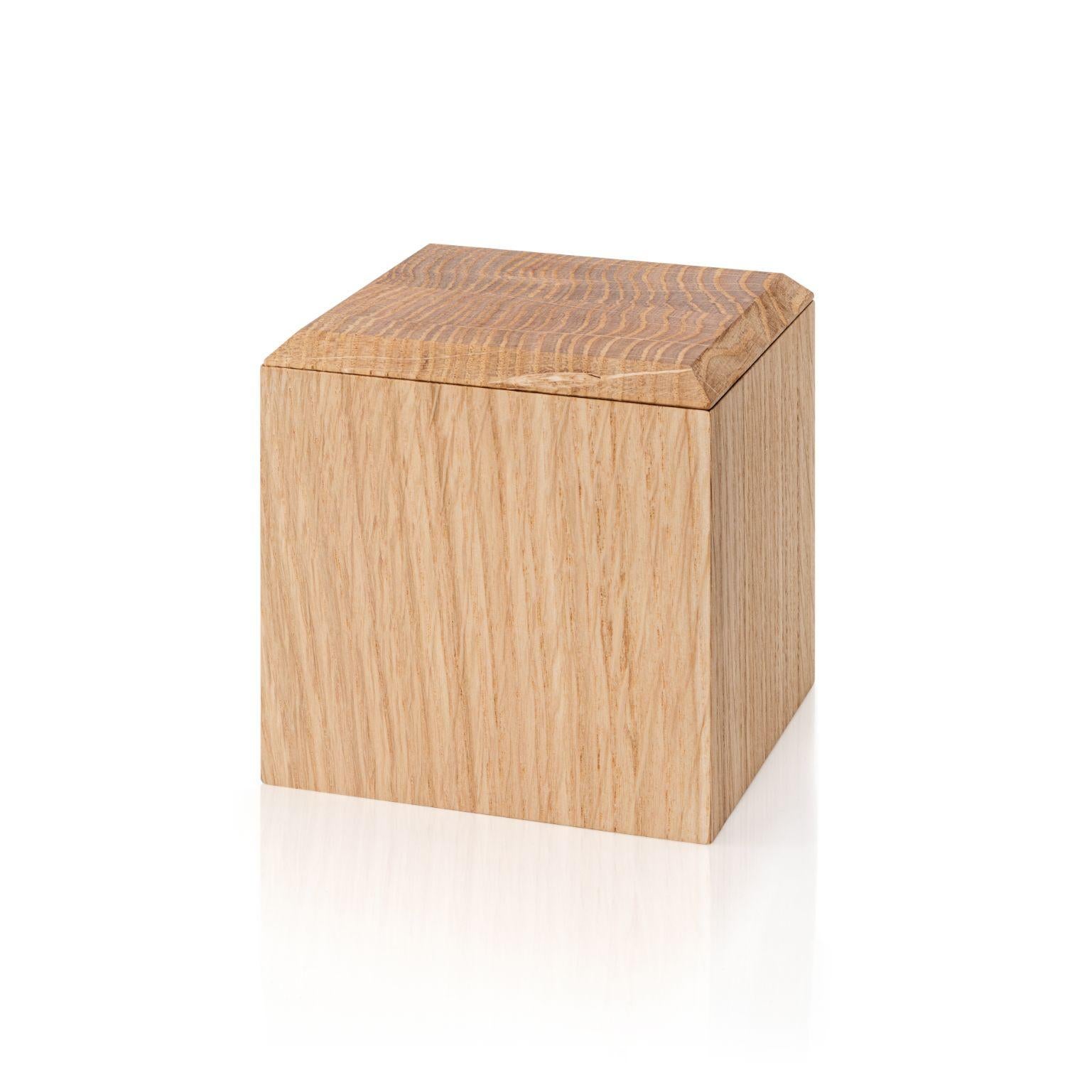 Pino boxes - Medium by Antrei Hartikainen
Materials: Oak, natural oil wax
Dimensions: D 9, W 9, H 5 / 9,5 / 14cm

A set of three vertical and two horizontal stacking boxes constructed of vividly grained woods. The pino boxes may be arranged in