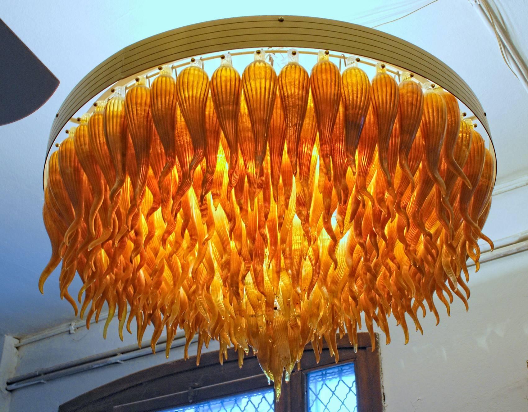 This chandelier was made at Pino Signoretto's furnace. Owner of the piece said that he made two like this, one in aquamarine and cobalt mix and this one in onyx calcedonia glass which is a typical Signoretto glass finish, used in small sculptures.
