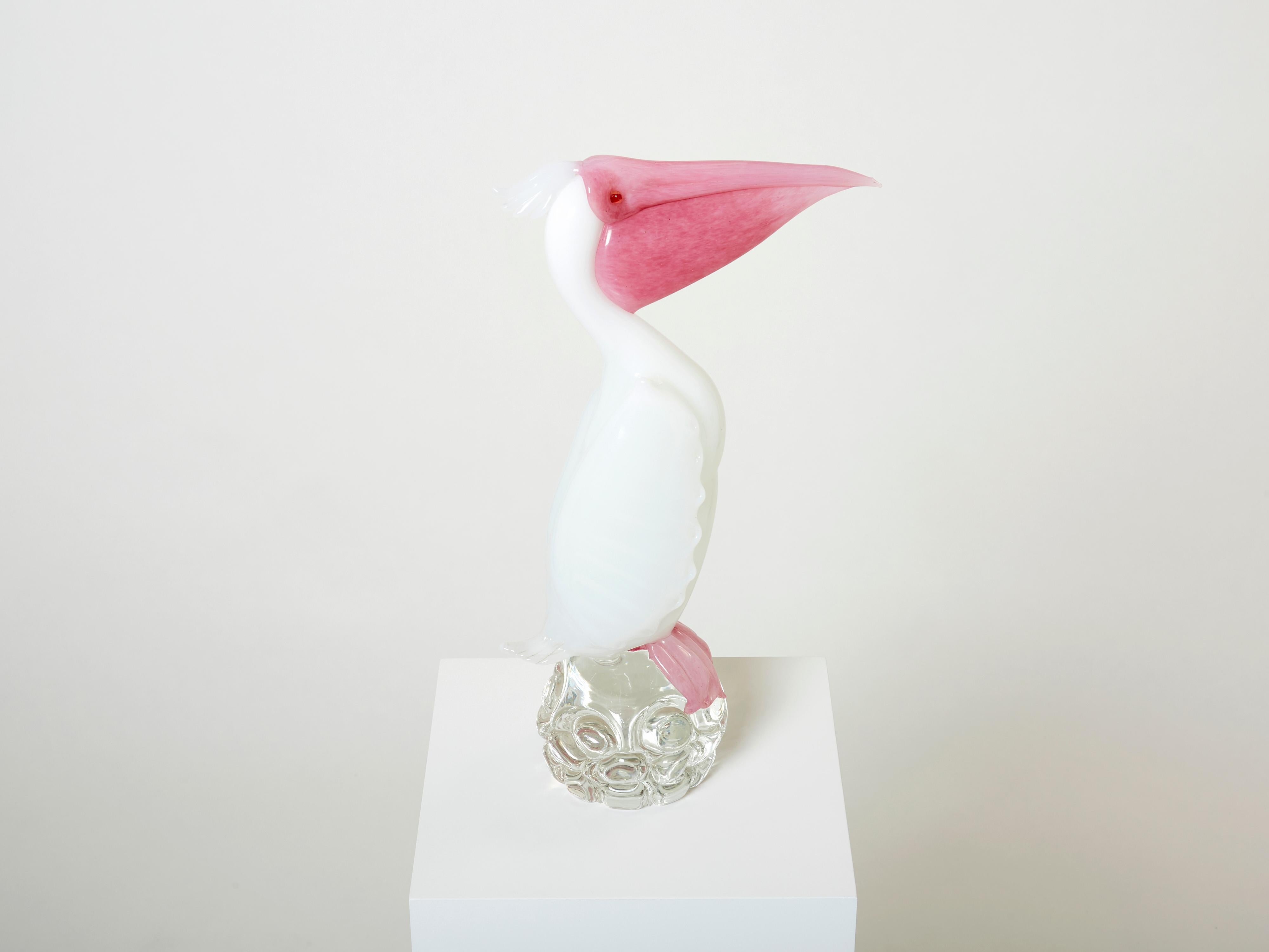 Beautiful Murano glass Pelican sculpture, on a crystal pedestal, made by Pino Signoretto in Italy in the late 1970s. This piece was created using Murano glass crystal and lattimo technique, with an amazing attention to details despite the