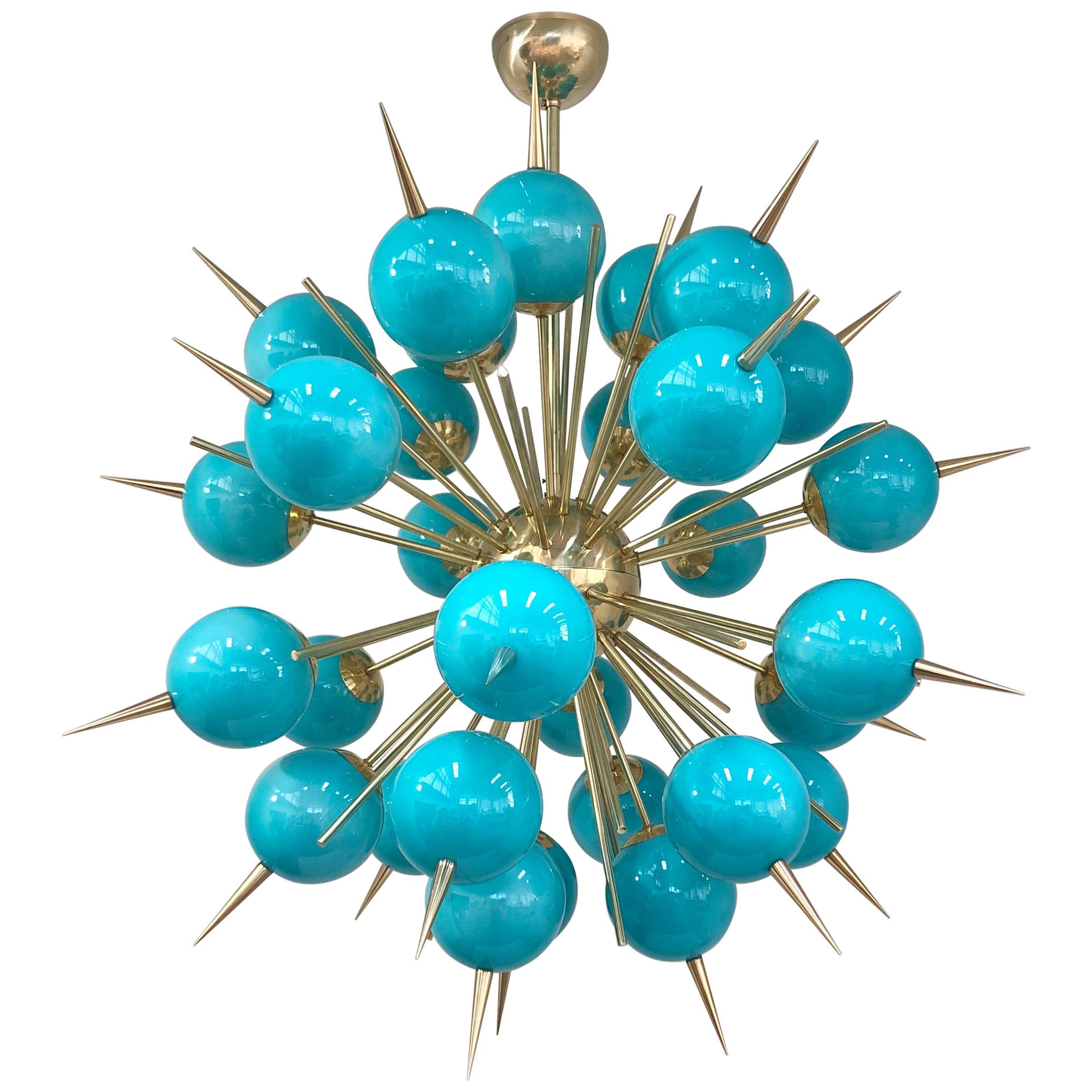 Italian sputnik chandelier with 30 Tiffany blue Murano glass globes and solid brass spikes mounted on brass frame / Designed by Fabio Bergomi for Fabio Ltd / Made in Italy
30 lights / E12 or E14 type / max 40W each
Measures: Diameter 47 inches /