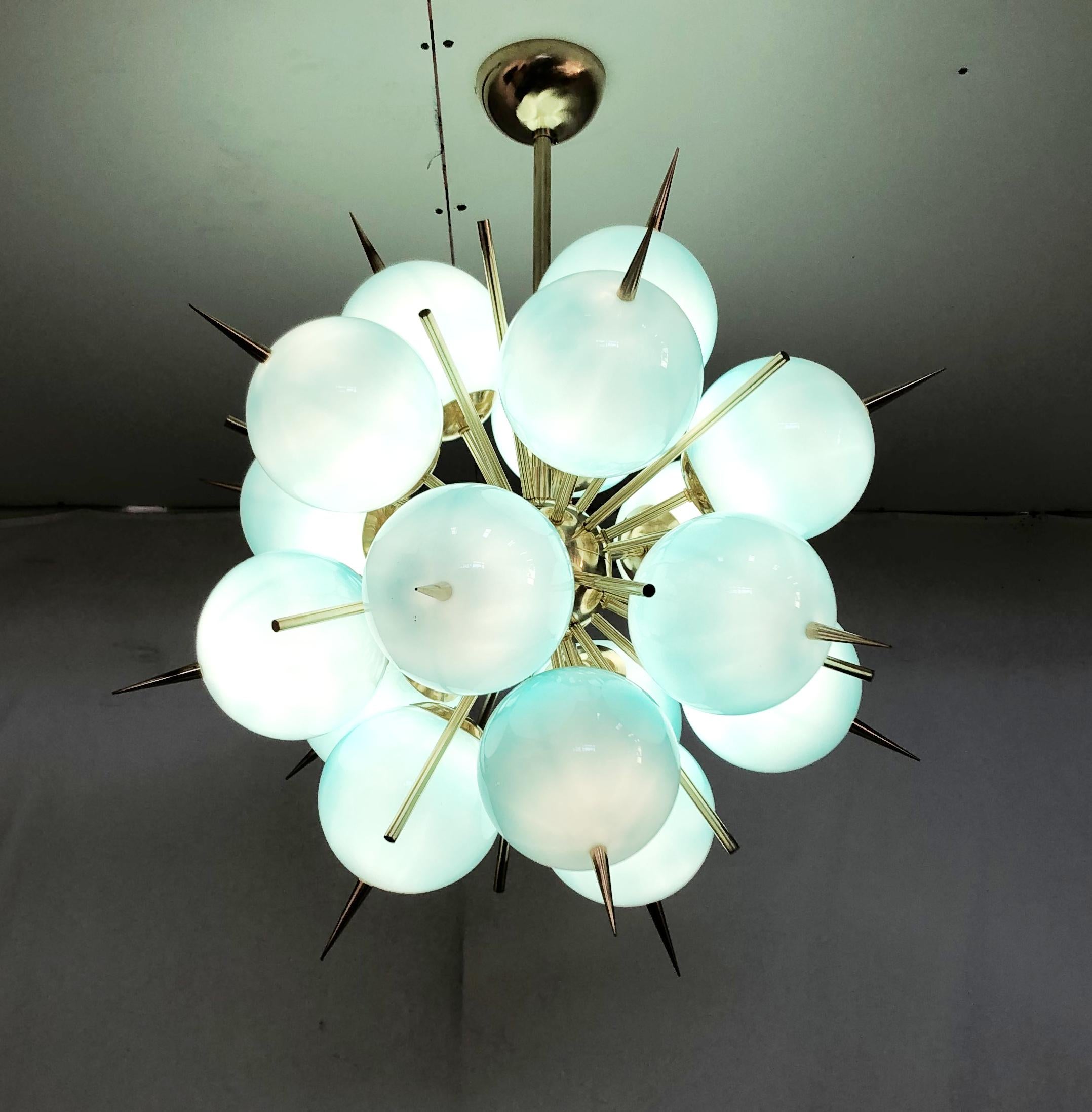Italian sputnik chandelier with 18 Tiffany blue Murano glass globes and solid brass spikes mounted on brass frame / Designed by Fabio Bergomi for Fabio Ltd / Made in Italy
18 lights / E12 or E14 type / max 40W each
Measures: Diameter 28 inches,