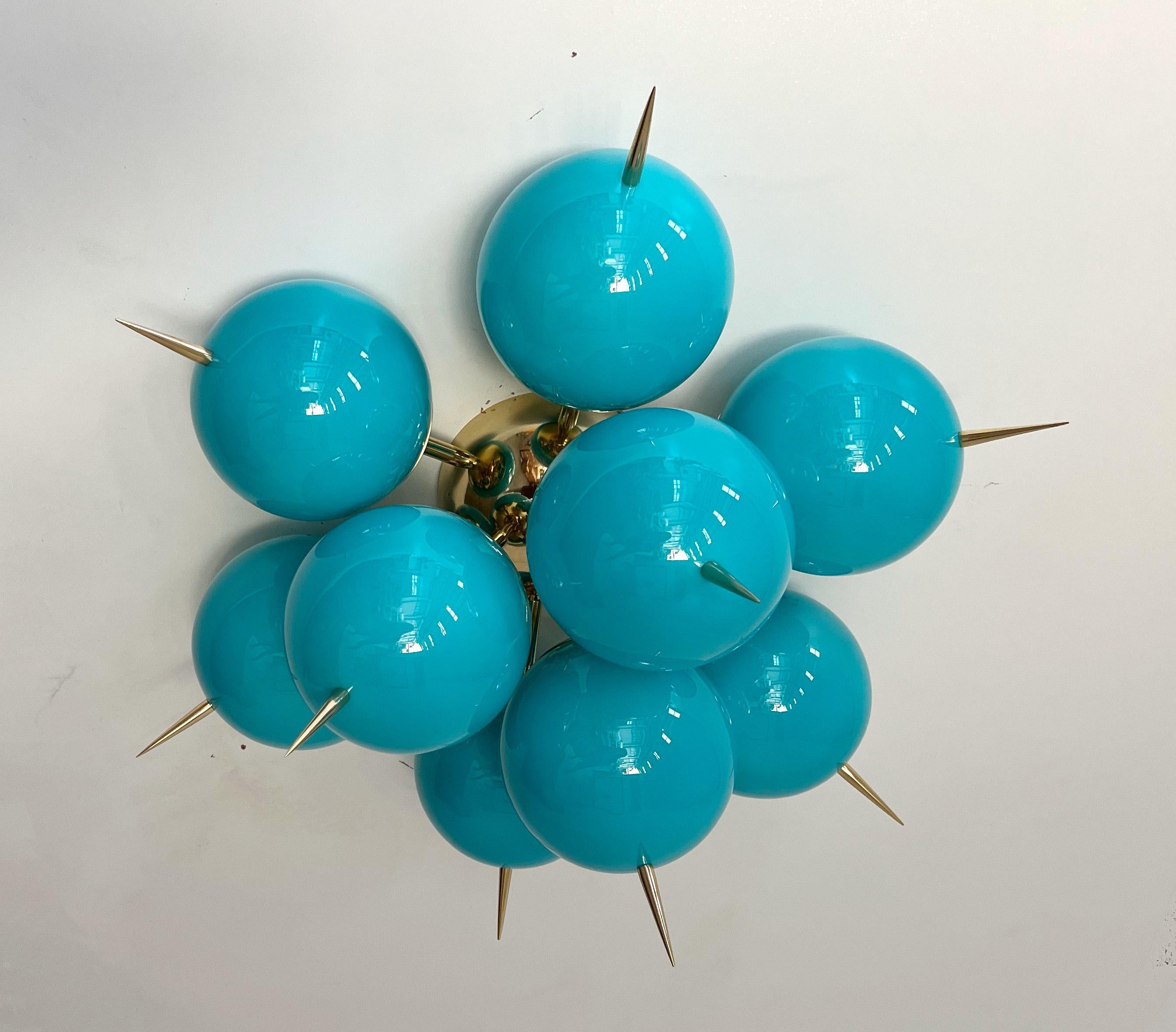 Italian sputnik flush mount with 9 Tiffany blue Murano glass globes and solid brass spikes mounted on  brass frame / Designed by Fabio Bergomi for Fabio Ltd / Made in Italy
9 lights / E12 or E14 type / max 40W each
Measures: Diameter 25 inches,