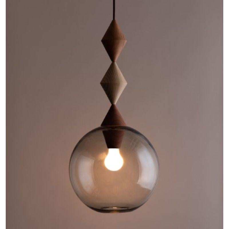 Futura light by Lina Rincon
Dimensions: 50 x 50 x 30 cm
Materials: Blown Glass, Brass

All our lamps can be wired according to each country. If sold to the USA it will be wired for the USA for instance.

Colors and dimensions may slightly