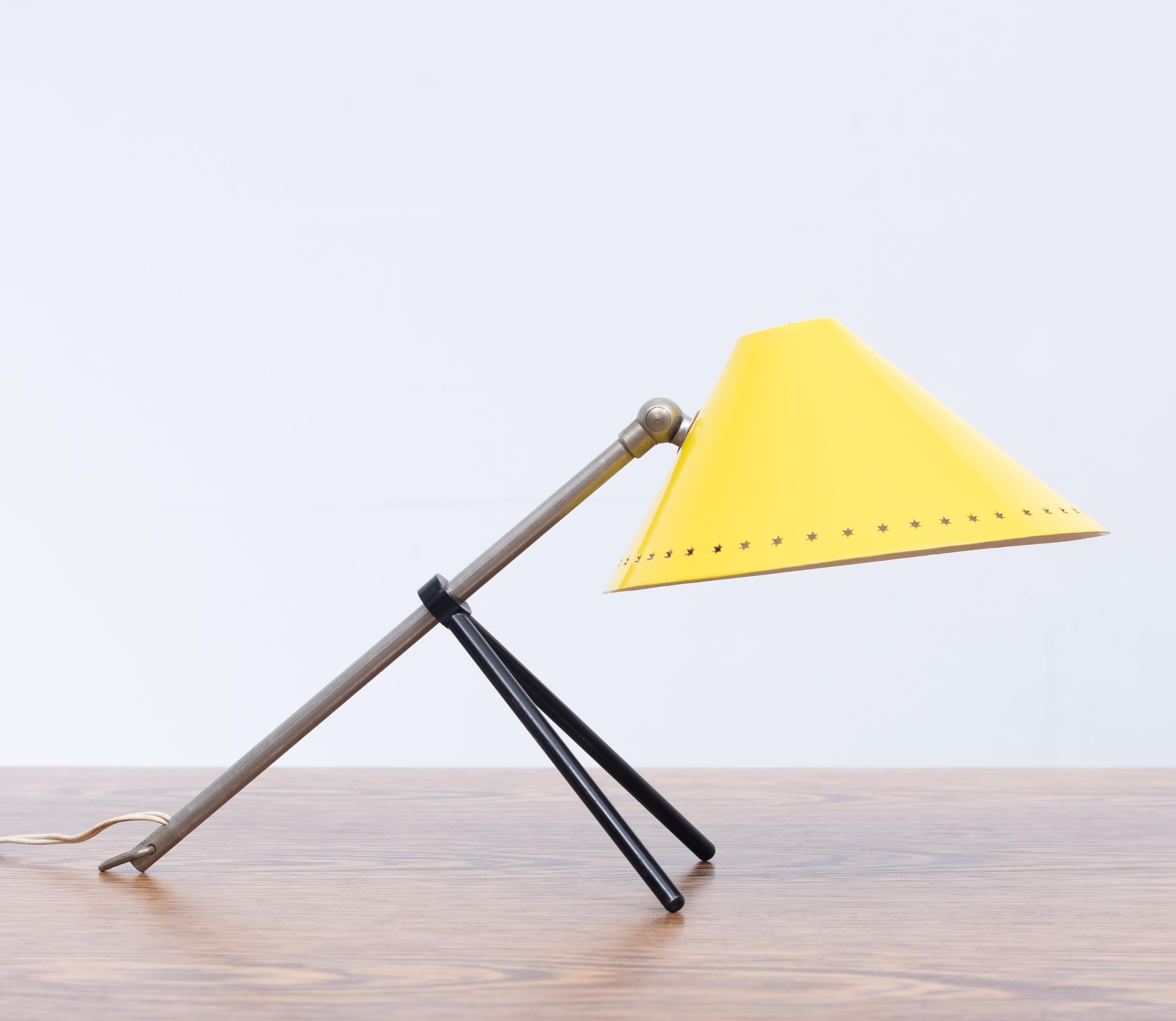 So well designed this little Yellow Pinocchio table lamp. Adjustable in hight by moving
Its feet down the rod, also the shade can be moved in any direction. Al original and in a 
Very good condition.