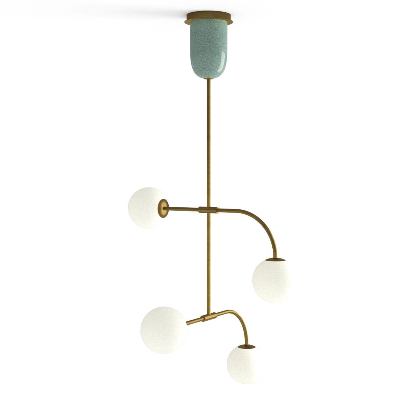 A graceful brushed bronze frame enriched with a light-blue-glazed ceramic element fitted to the ceiling mount distinguishes this elegant pendant lamp. Distilling soft vintage flair, four arms - two of which are marked by a downward curve - support