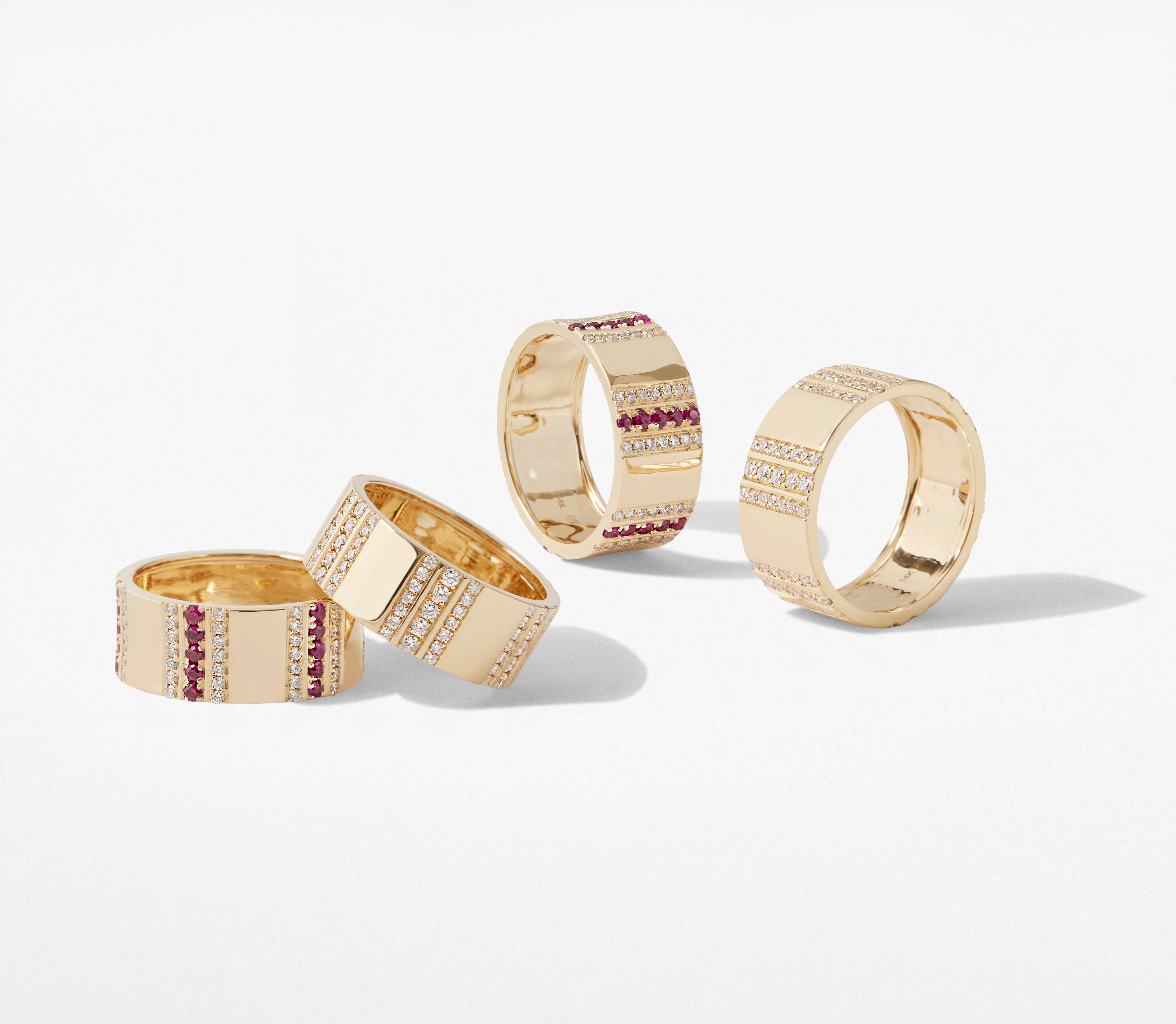 Highly polished 14k yellow gold with 114 hand-set Brilliant Cut diamonds and Rubies set in a pinstripe pattern define this bold and glamorous ring. With its bold and sturdy feel, this collection symbolizes strength and power. This stackable ring