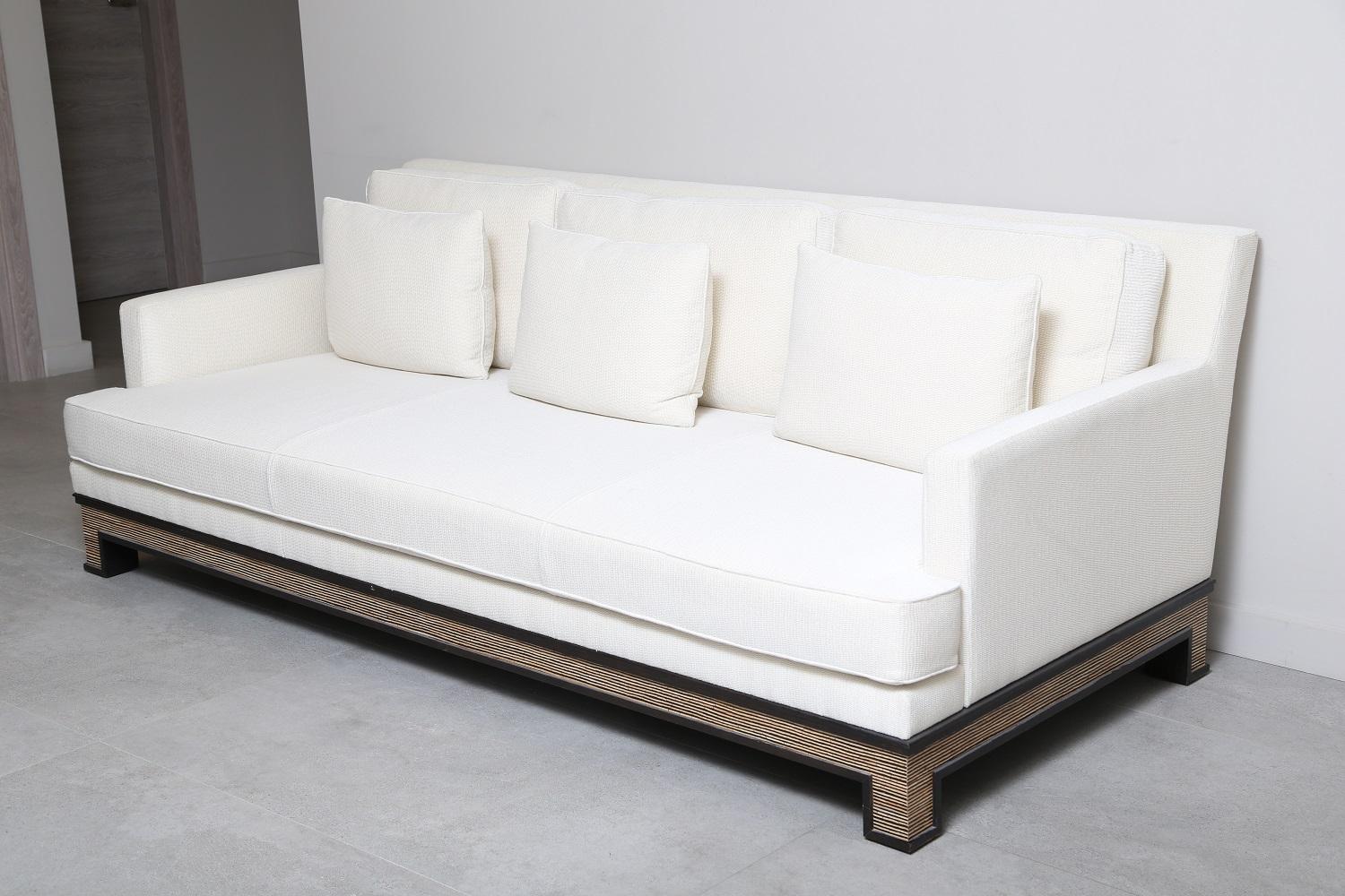 Upholstered sofa. Beech frame and solid oak base, Inserts of coco-shell, mosaic of coco and shells.
One seat cushion, three back cushions and three soft pillows. Made in France.

Dimensions
Height : 31.50”
Seat height : 14.56”
Width :