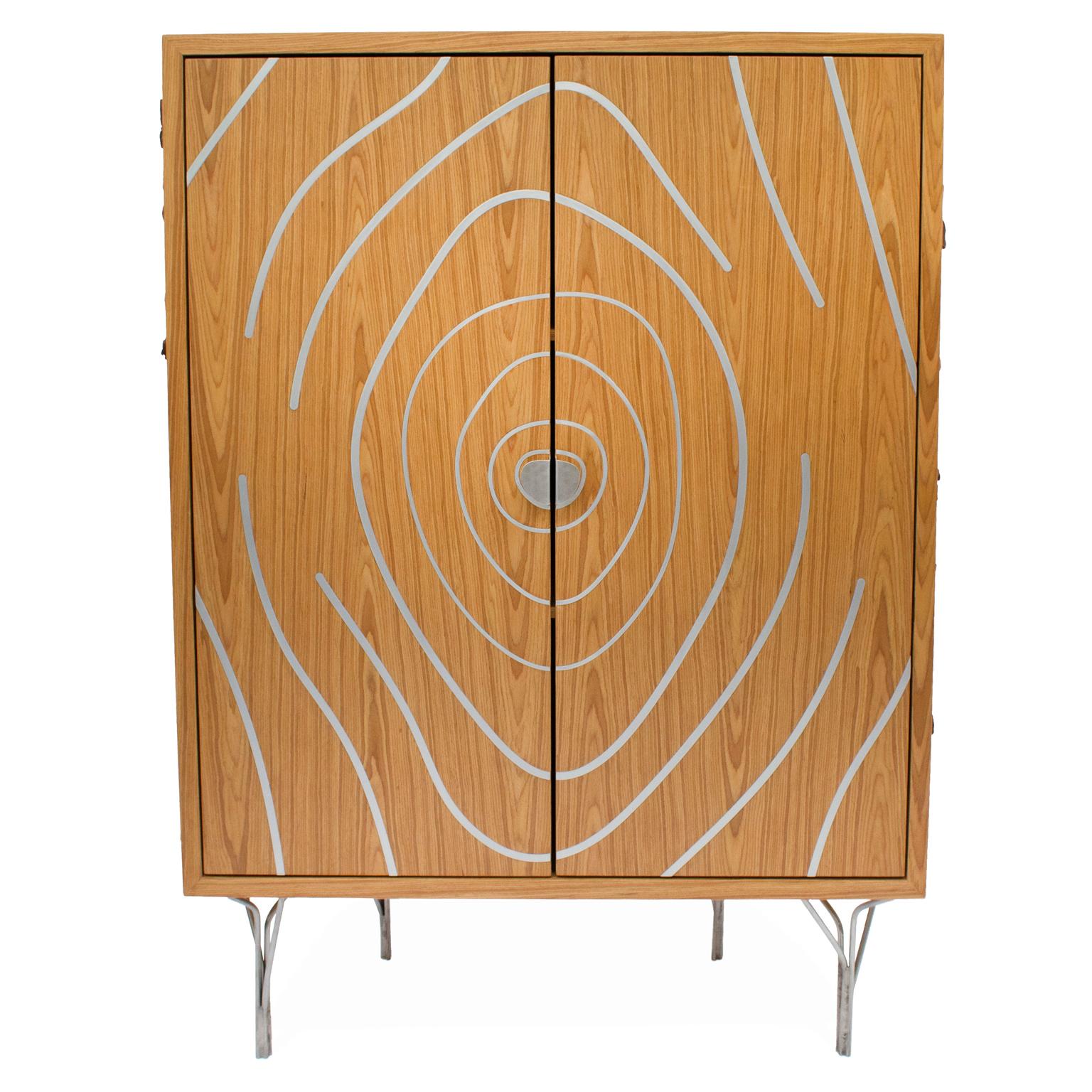 This contemporary style cabinet is part of the Tronco collection, for the purpose of representing the shape of a sliced tree, referring to the trunk. All their search for formats depart from nature, from the represented veins to the branches made of