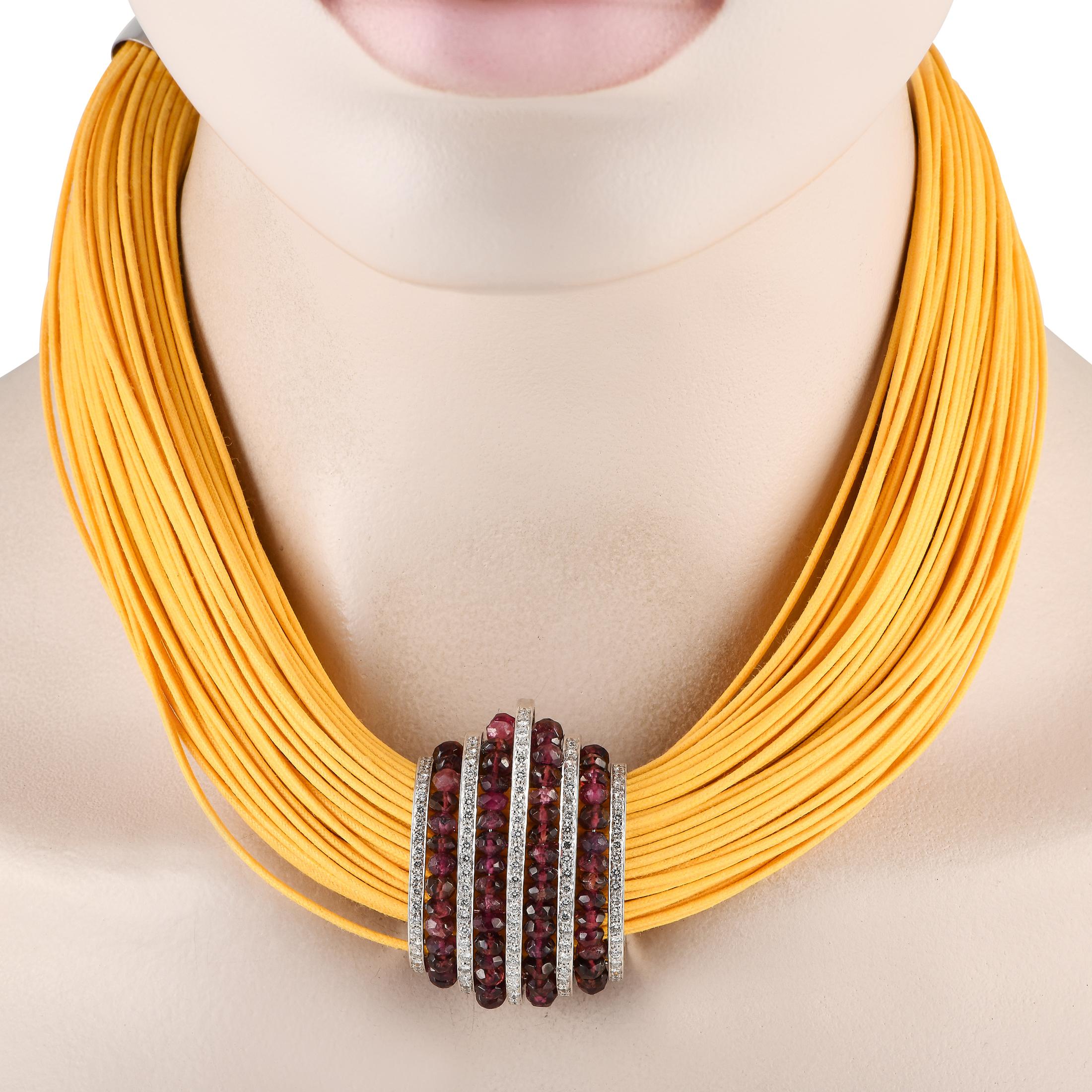 This bold Piodoro necklace will continually make a stylish statement. At the center of the multi-strand silk cord, youll find an 18K White Gold pendant measuring 7.5 long. Its adorned with a sparkling array of Tourmaline gemstones and Diamonds