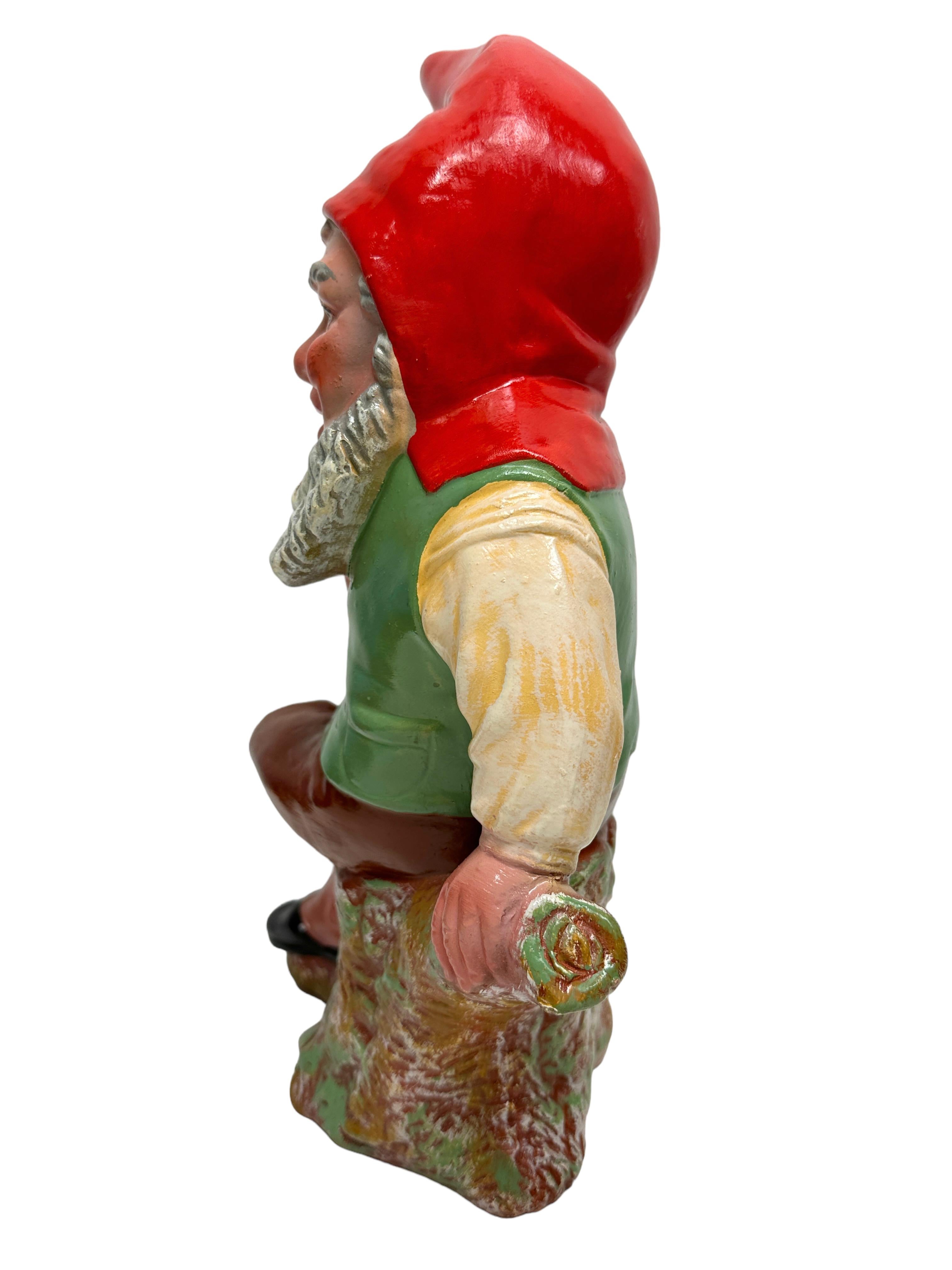 A gorgeous character ceramic figural gnome statue. This character statue has been made in Germany, in the 1920s or older. Absolutely gorgeous item with lots of character and still in good, used condition, without damage. Some paint lost, but this is