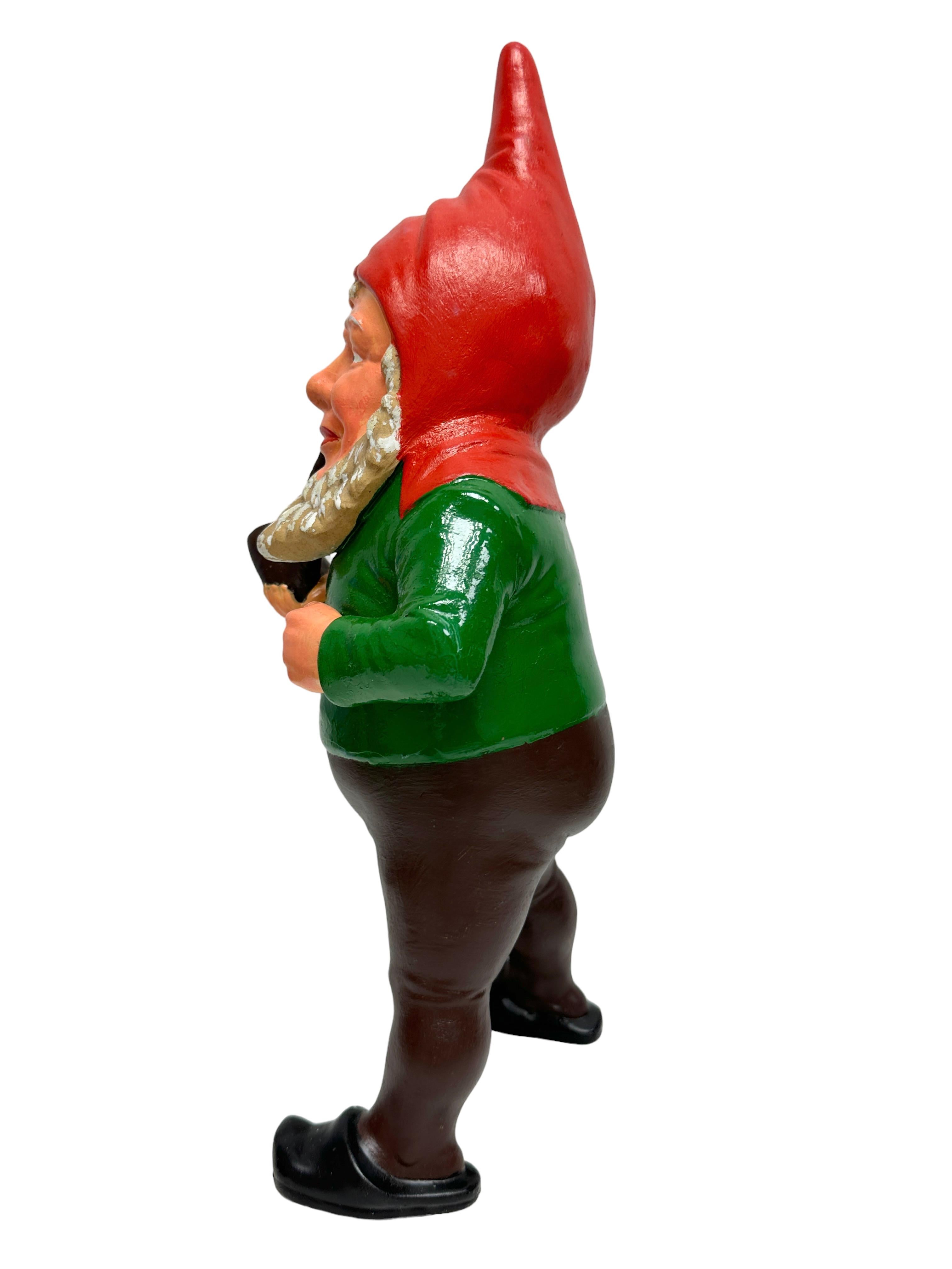 A gorgeous character ceramic figural gnome statue. This character statue has been made in Germany, in the 1920s or older. Absolutely gorgeous item with lots of character and still in good, used condition, without damage. Some paint lost, but this is