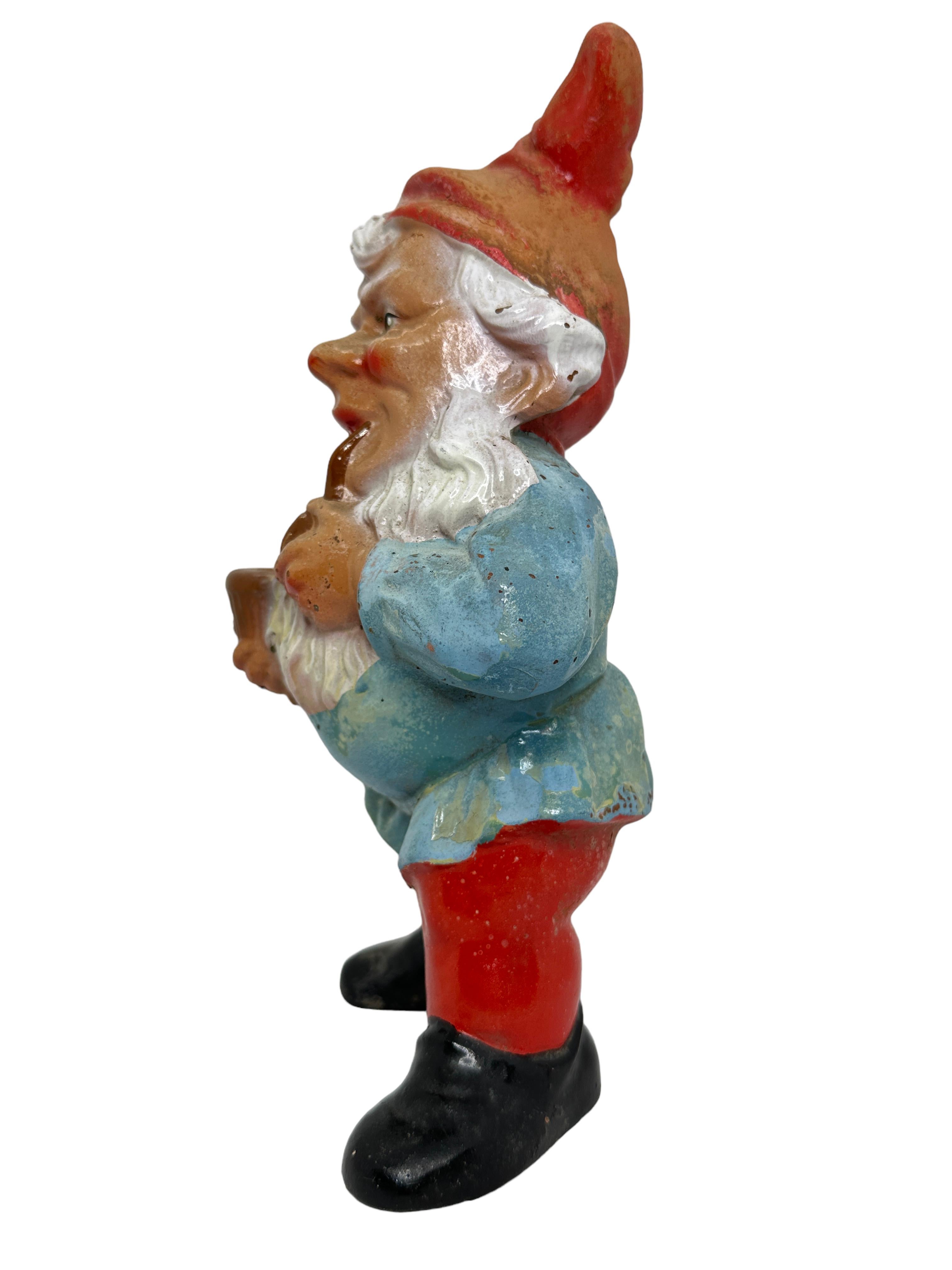 A gorgeous character ceramic figural gnome statue - attributed to Griebel Germany, a well known manufacturer of this kind of figures. This character statue has been made in Germany, in the 1930s or older. Absolutely gorgeous item with lots of