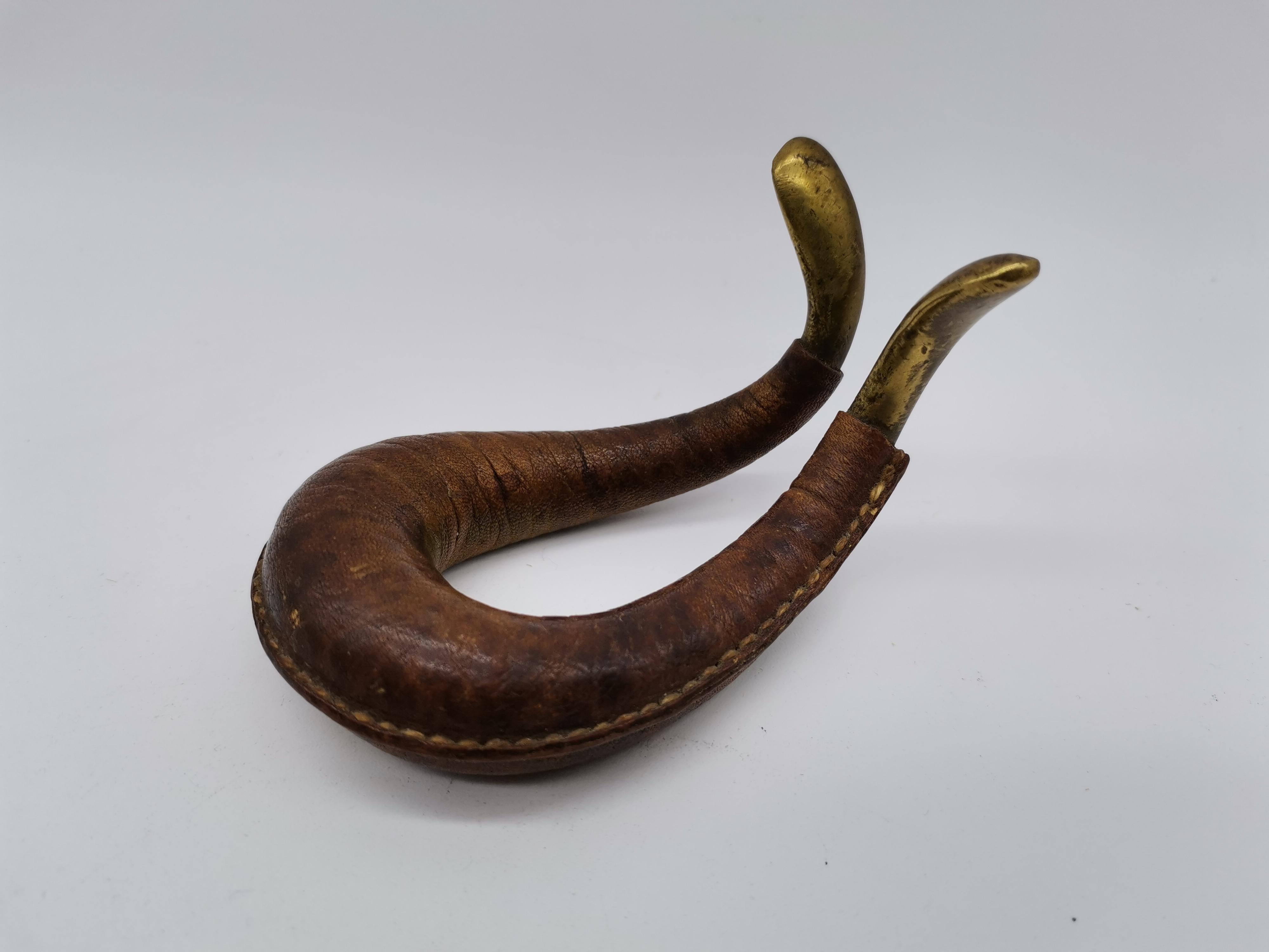 Pipe stand made by Carl Auböck coated with leather.