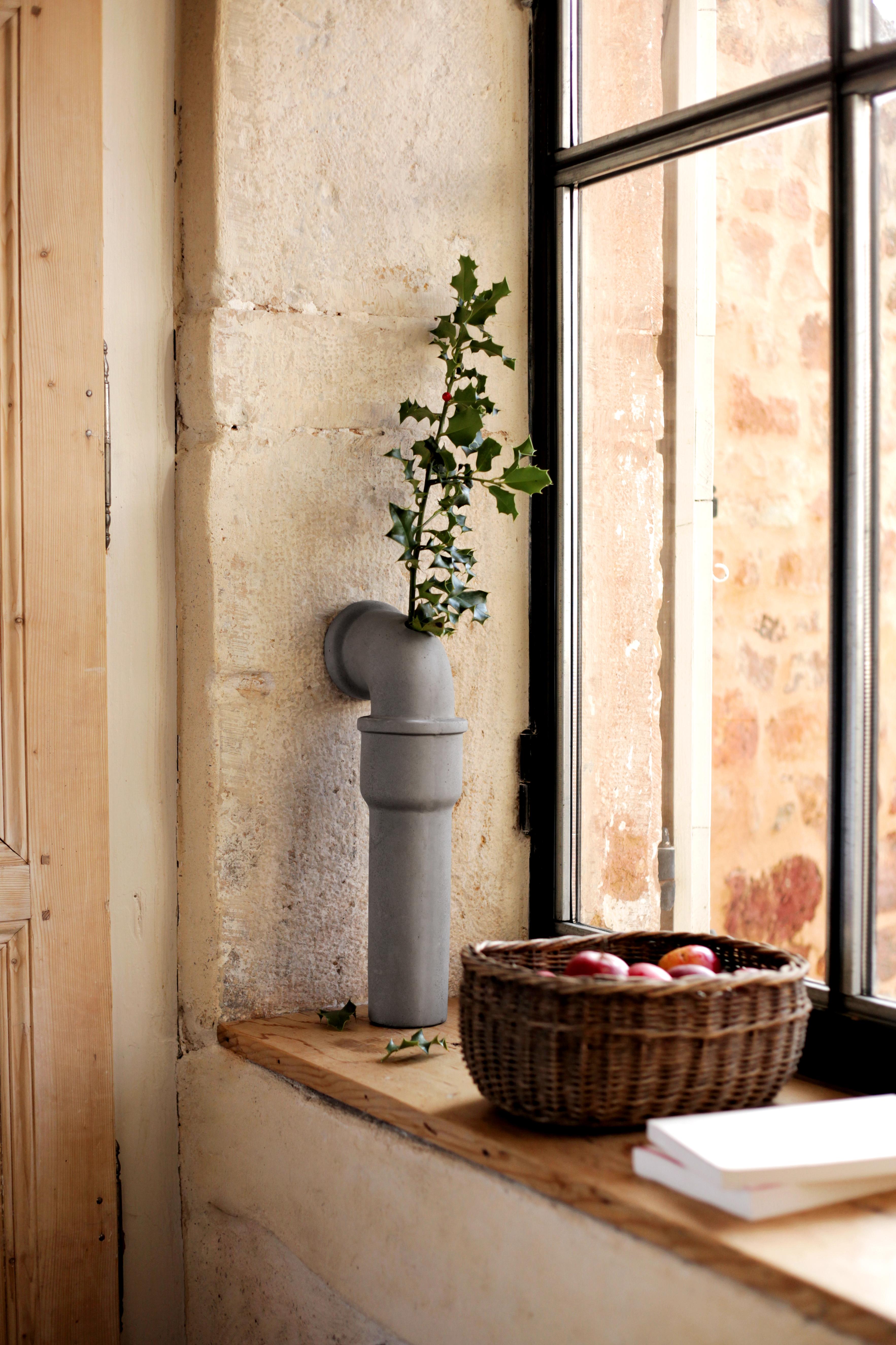 The Concrete Pipeline stem vase, designed by the french designer Bertrand Jayr for Lyon Béton, is inspired by the urban city. It diverts the visible pipelines we see in the streets and creates a dialogue between the inside and the outside. When