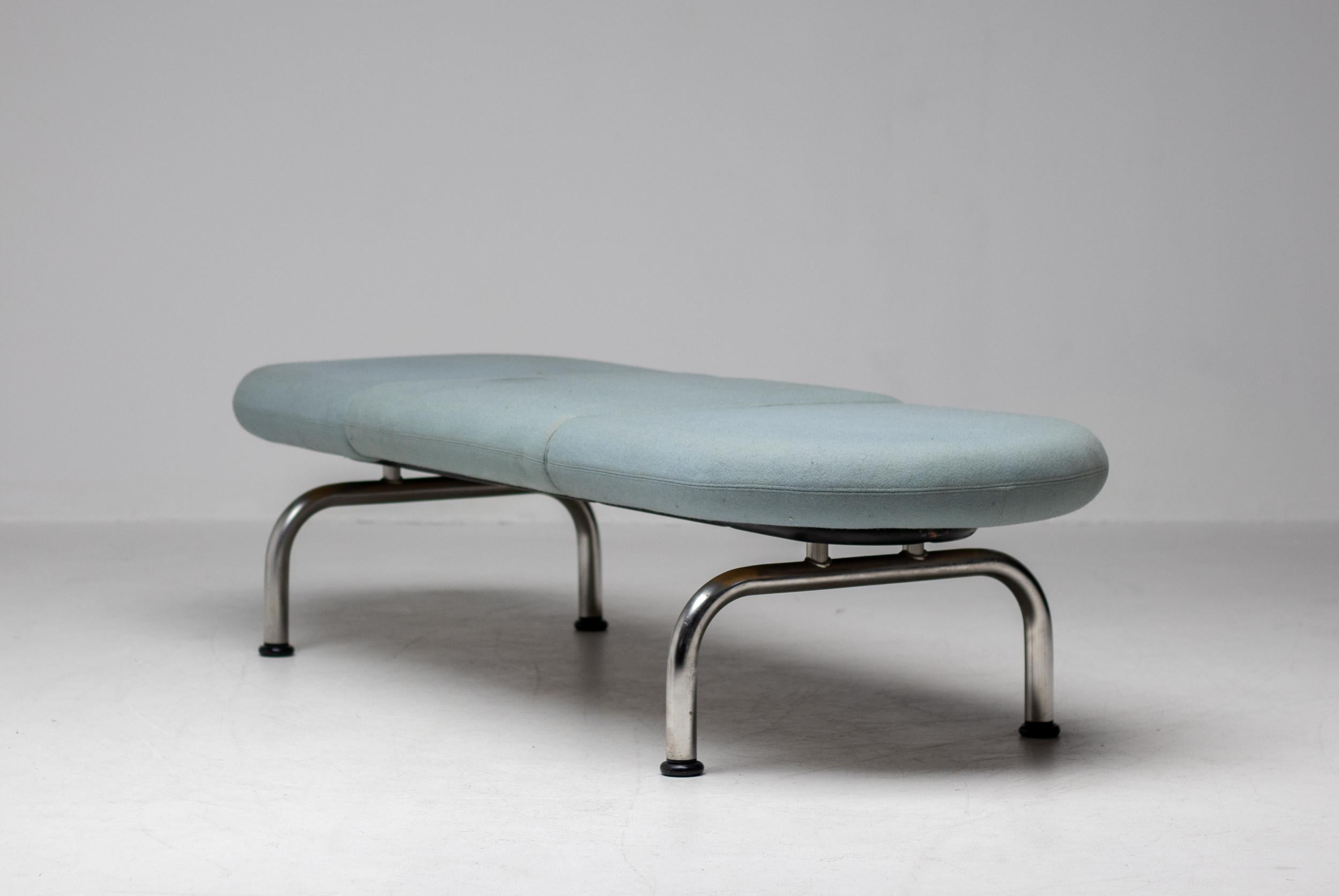 Stunning and rare Pipeline Bench by Erik Ole Jørgensen for Georg Jørgensen & Søn, Denmark, 1960.
The tubular legs are made in stainless steel and the top is upholstered in a grey/green Kvadrat fabric.
The foam is not resilient anymore and the fabric