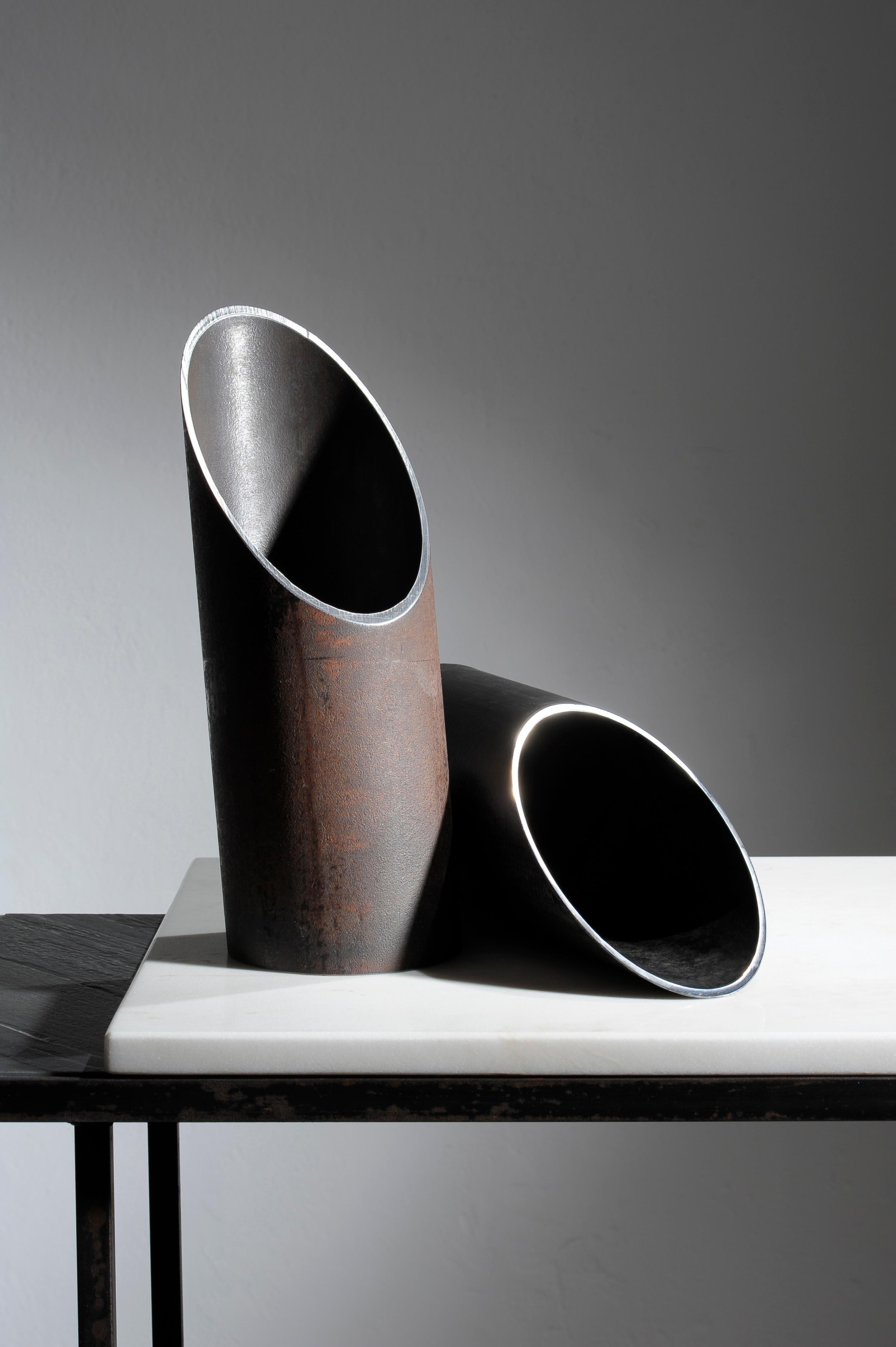 Pipe,Pair of Steel Sculpted Vases, Signed by Lukasz Friedrich
Steel vases “Pipe”
Dimensions: D 12 x H 30 cm
Finish: black or rusty patina on steel, wax
Unique and signed.