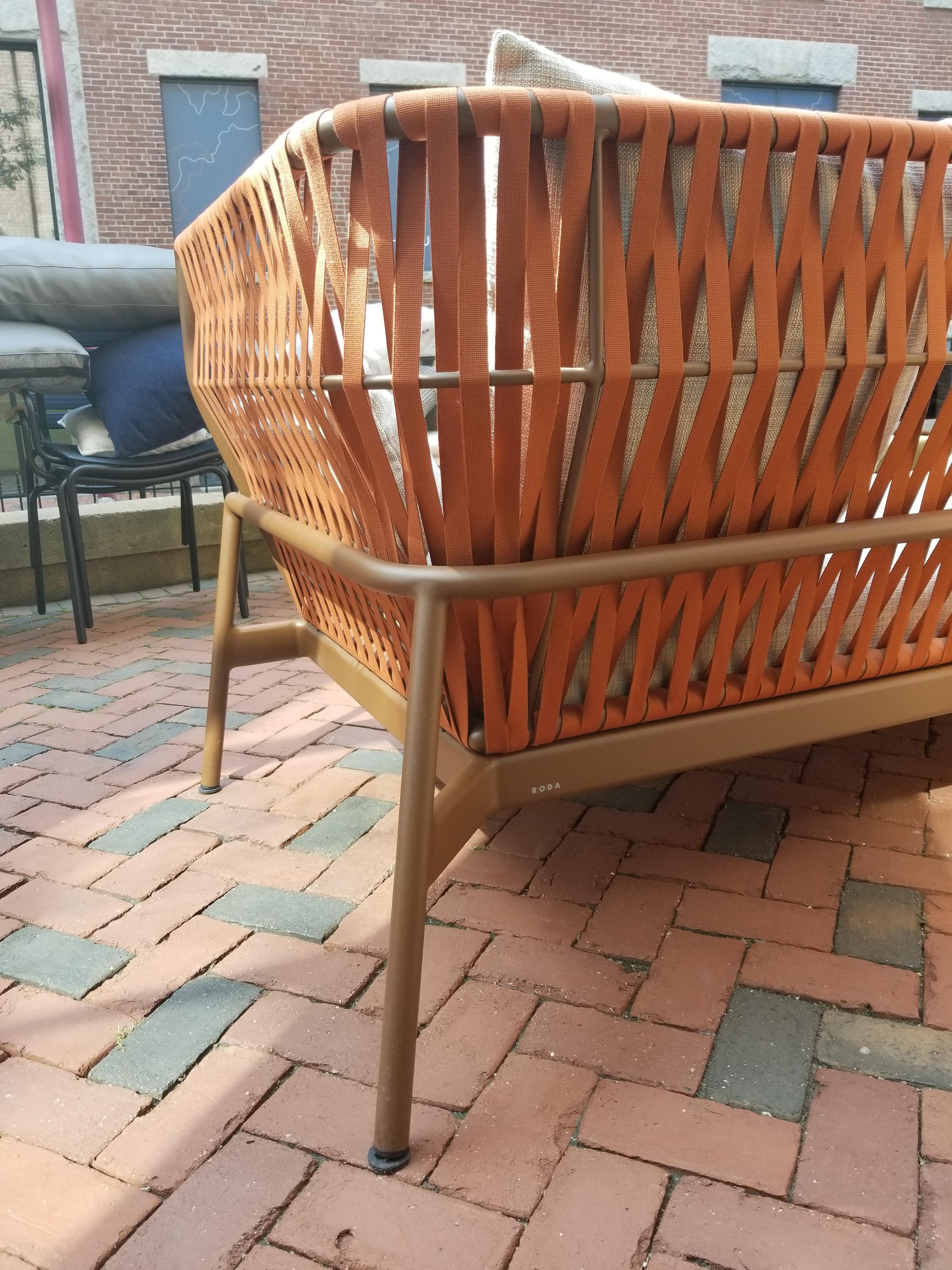Designed by Rodolfo Dordoni

This item is part of our outdoor display.

Frame Finish: Rust

Belt Finish: Orange

Fabric: Park K01 Sand

Includes 3 Seat Cushions, 3 Back Cushions, and 2 Arm Cushions

Throw Pillows Sold Separately

Hydro