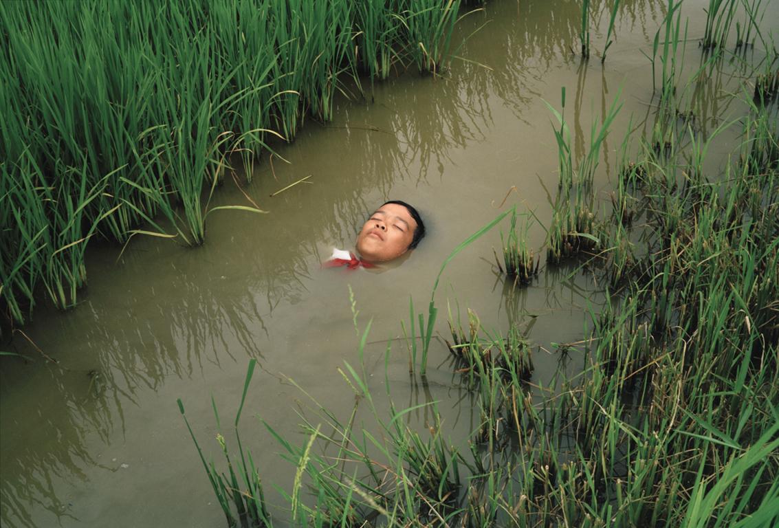 Pipo Nguyen-Duy Color Photograph - Boy in Water