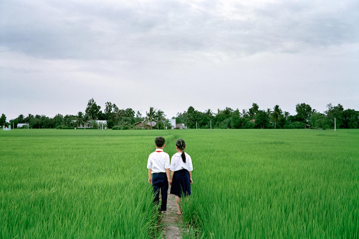 Pipo Nguyen-Duy Landscape Photograph - Couple Walking Home