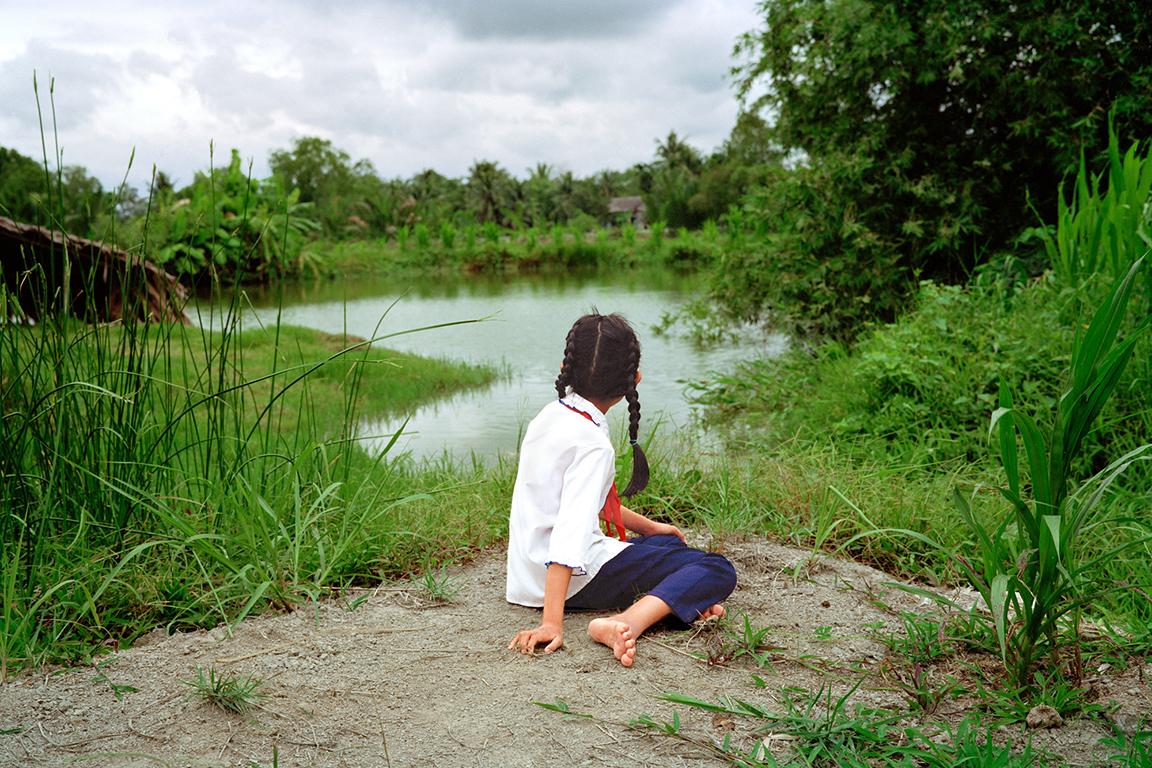 Pipo Nguyen-Duy Landscape Photograph - Girl by the River