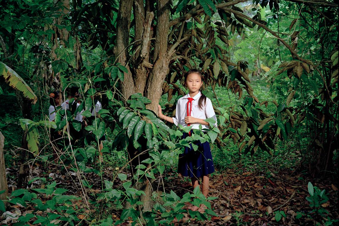 Pipo Nguyen-Duy Color Photograph - Girl in Wood
