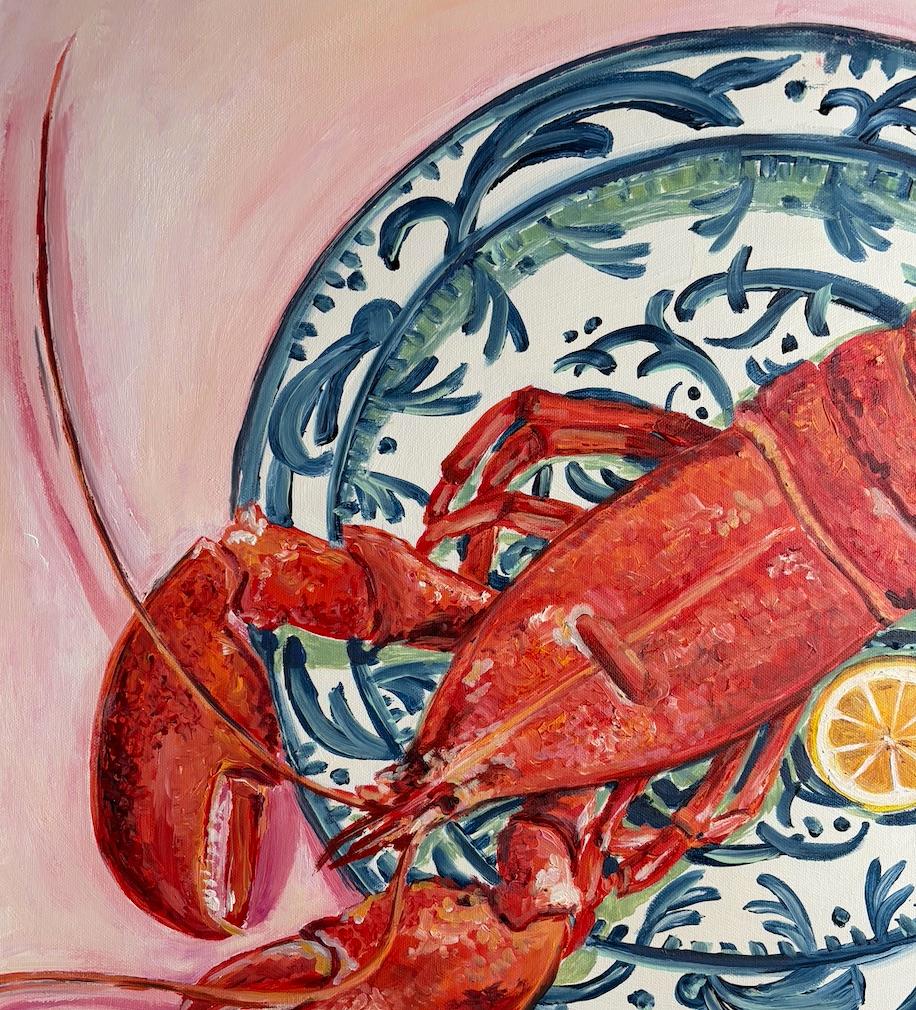 This vibrant and contemporary still-life painting depicts a fresh and juicy lobster with a lemon on a traditional Hispanic blue and white ceramic plate. Playing with a larger than life scale, this pice is both impactful and playful. The softly pink
