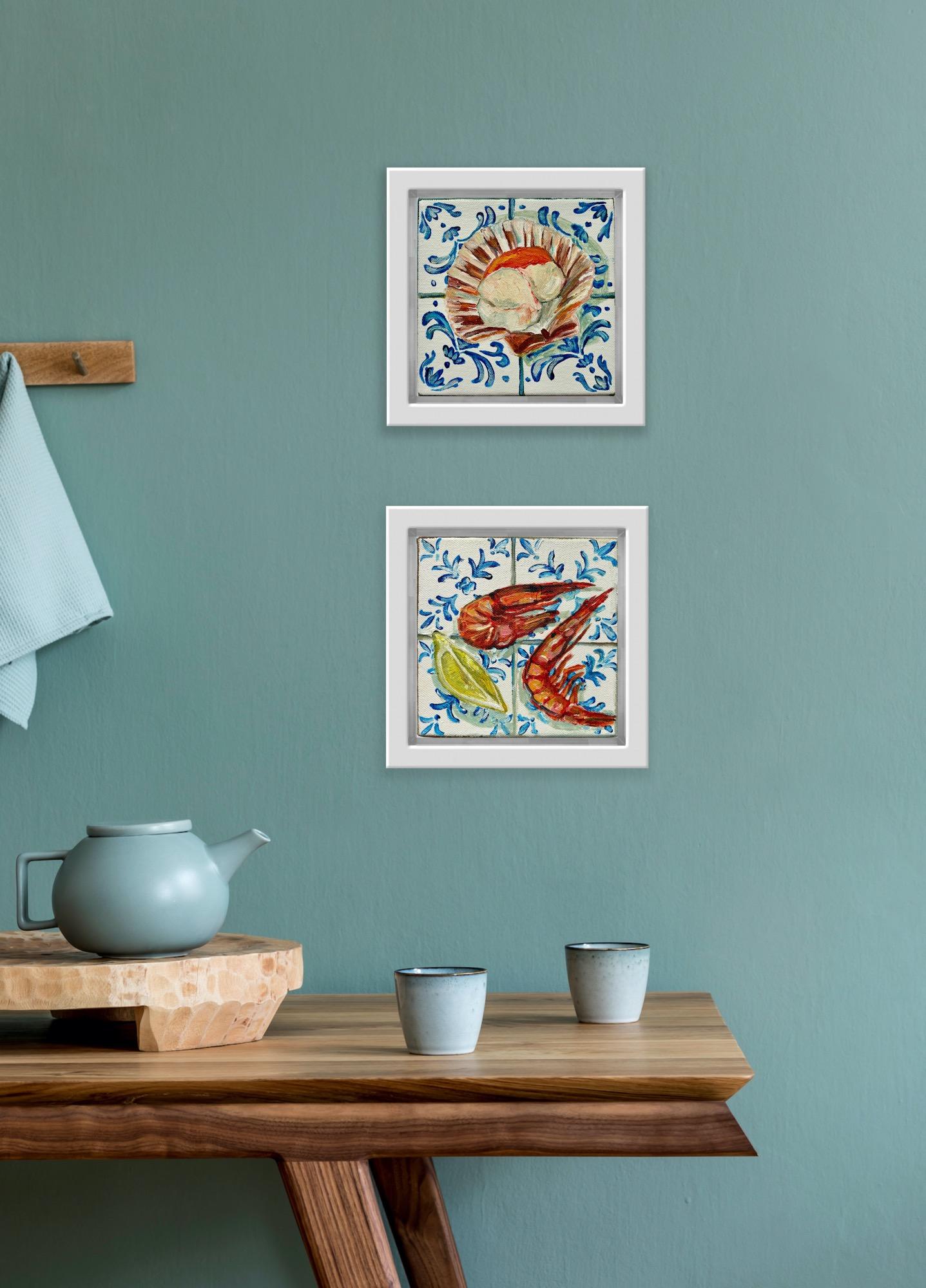 This is a diptych of Two Prawns & Lemon Wedge and Scallop on Tiles. Both paintings are same size. 
 
This contemporary still-life depicts two vibrant and juicy prawns with a lemon wedge on blue and white Mediterranean tiles. This box canvas is part