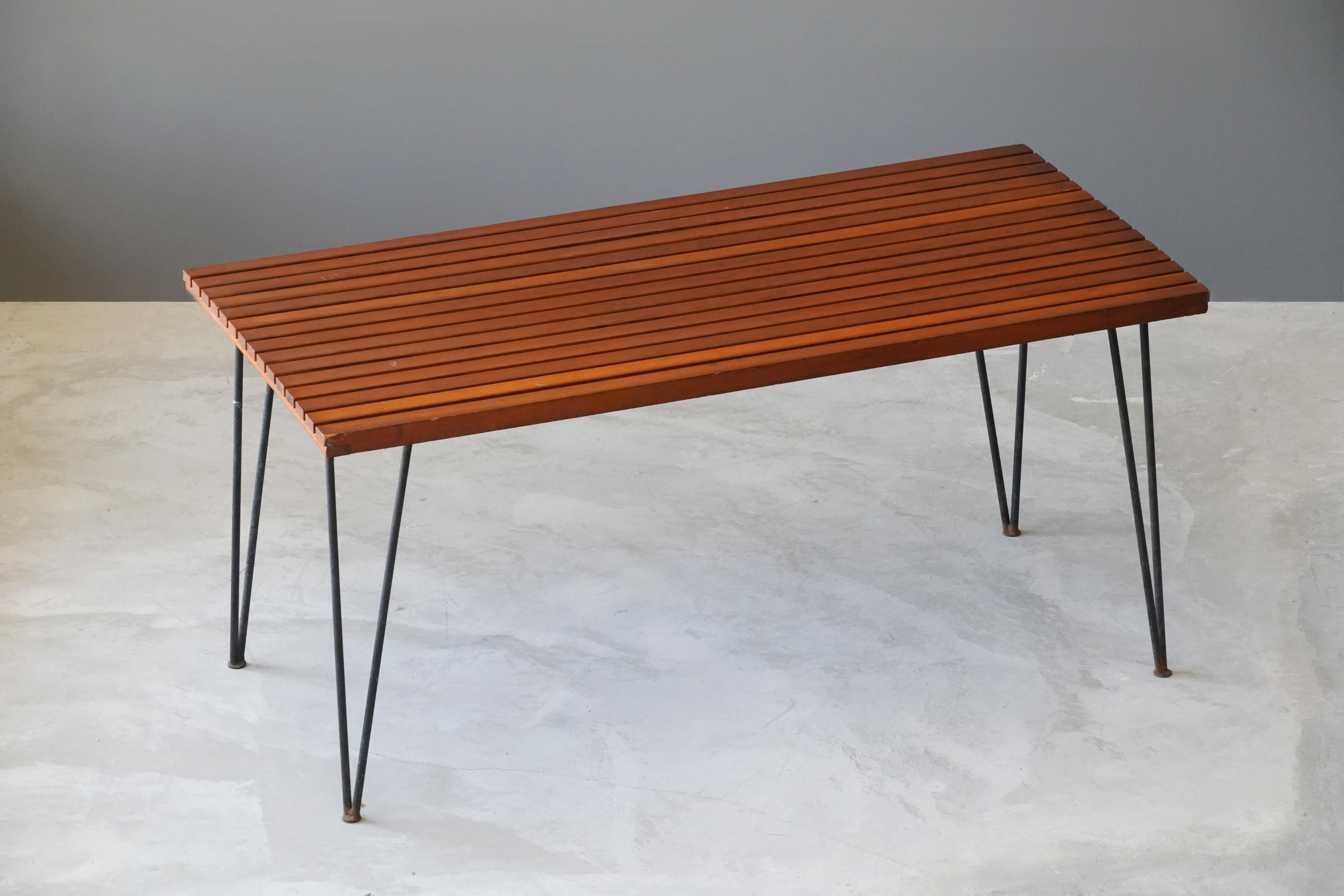 A dining table designed by husband and wife duo Pipsan Saarinen Swanson & J. Robert F. Swanson. Designed by their firm Swanson and Associates as part of the “Sol-Air” line for Ficks Reed Company, Cincinnati in 1949. 

The line was showcased at the