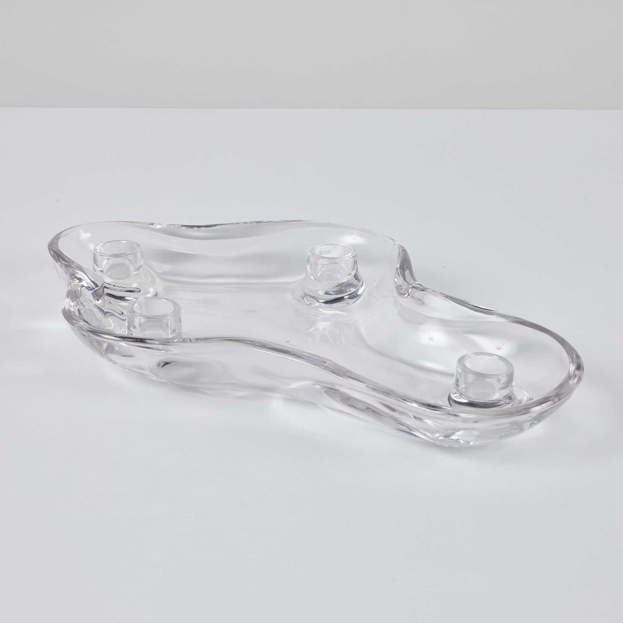 Biomorphic glass candle holder, by Pipsan Saarinen Swanson, c.1940s, USA for US Glass Company. Pipsan, part of the famous Saarinen cerated this smooth glass vessel which features a low profile and cavity for water to float flowers around 4 candle